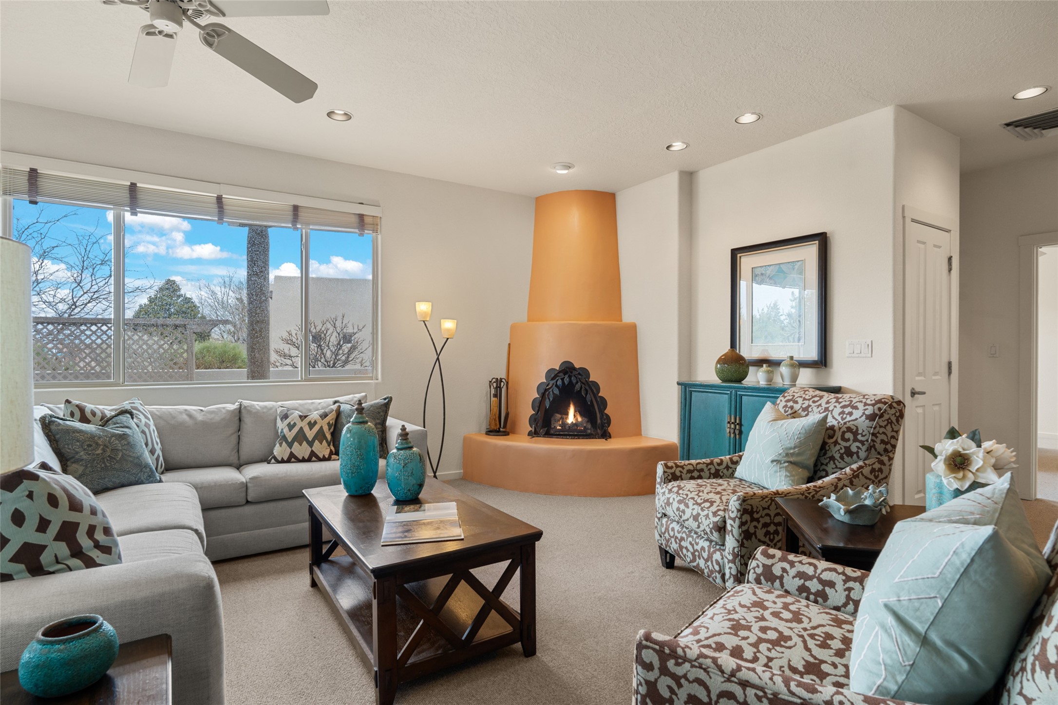 Welcome to 4 Ocotillo Place in Rancho Viejo - Living Room w/ corner Kiva Fireplace