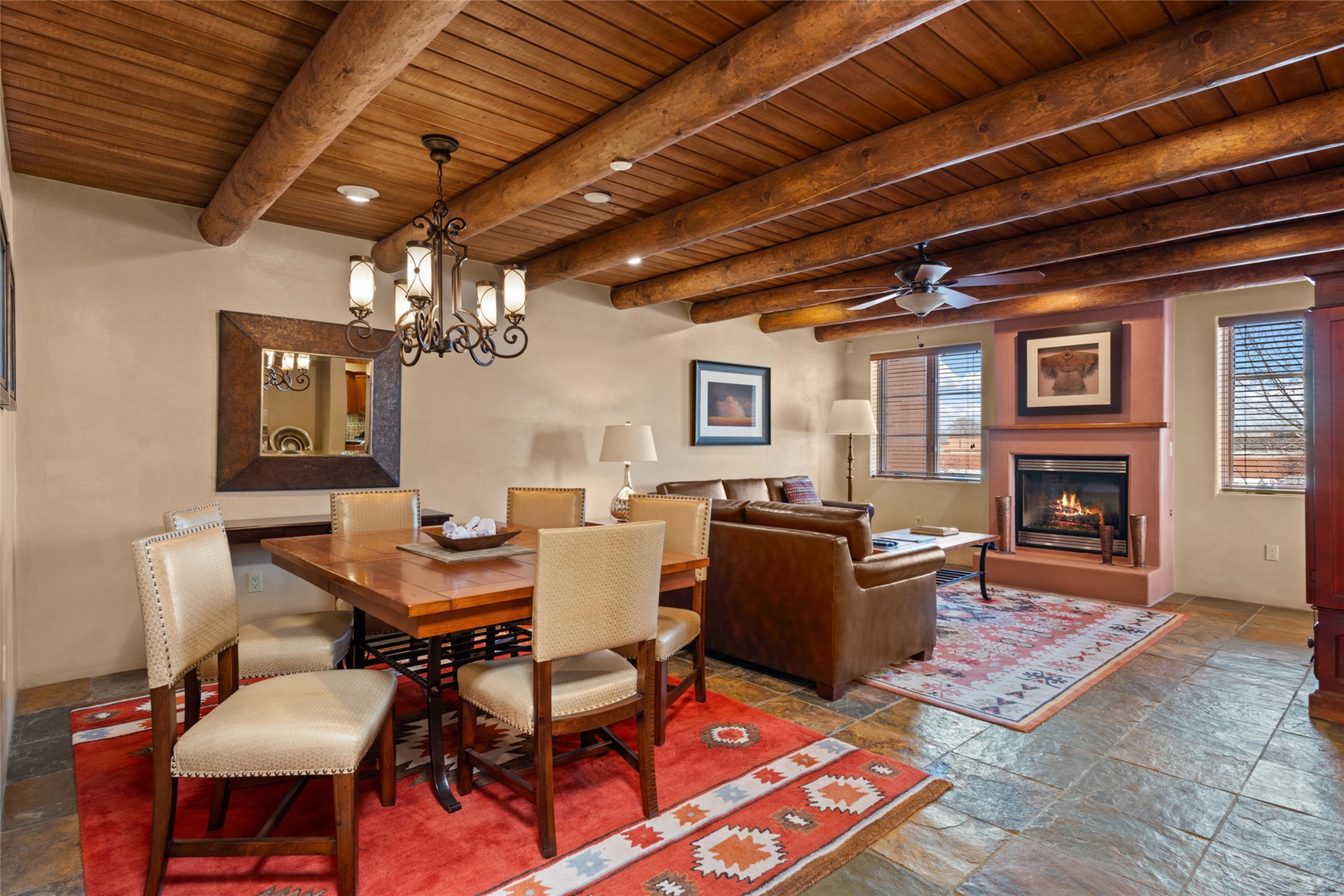 Step inside the condo and find the living area, featuring a lovely fireplace.