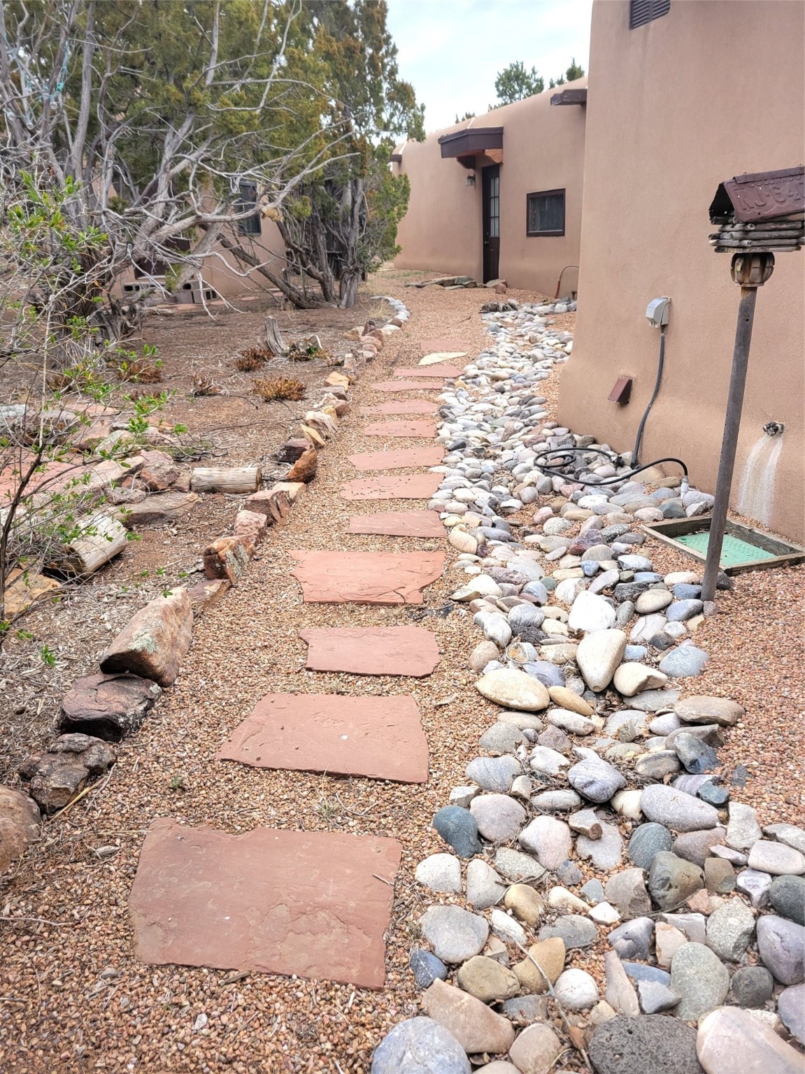 flagstone path in back of house to garage door
