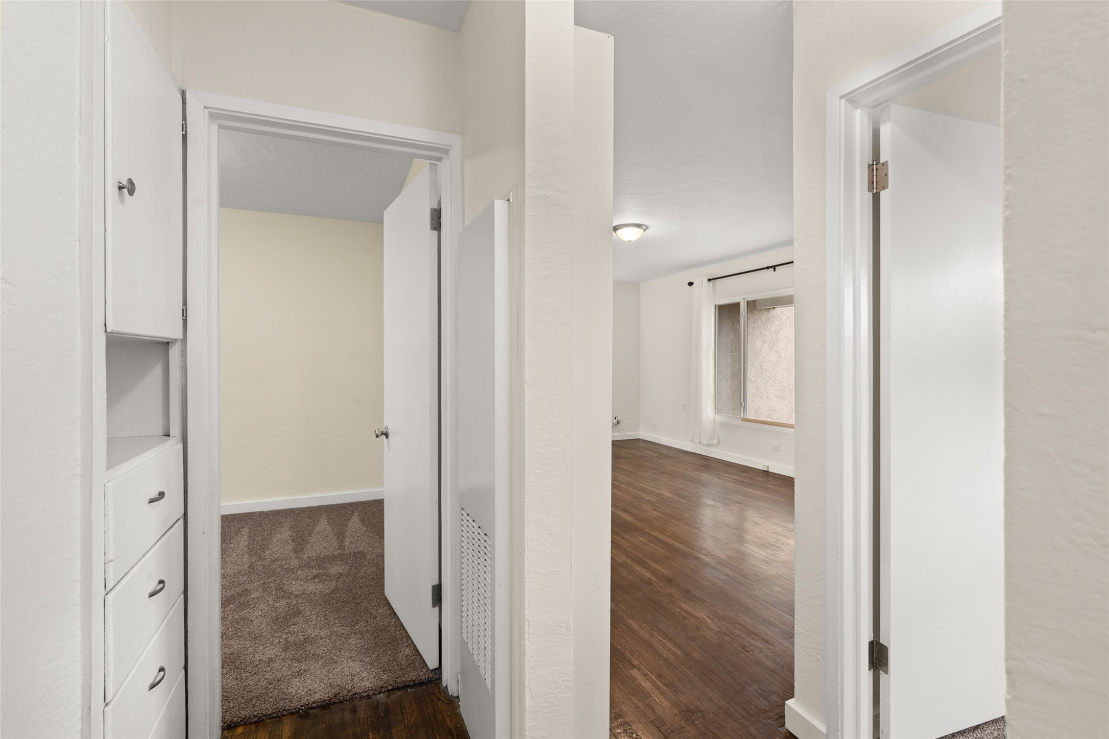 Hallway with build in linen and storage