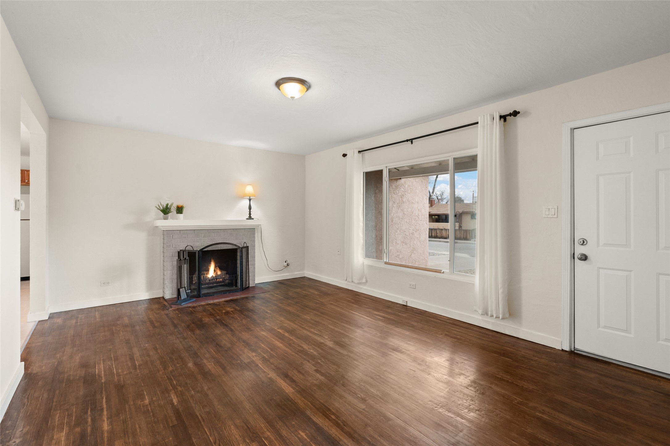 Livingroom with view of wood burning fireplace