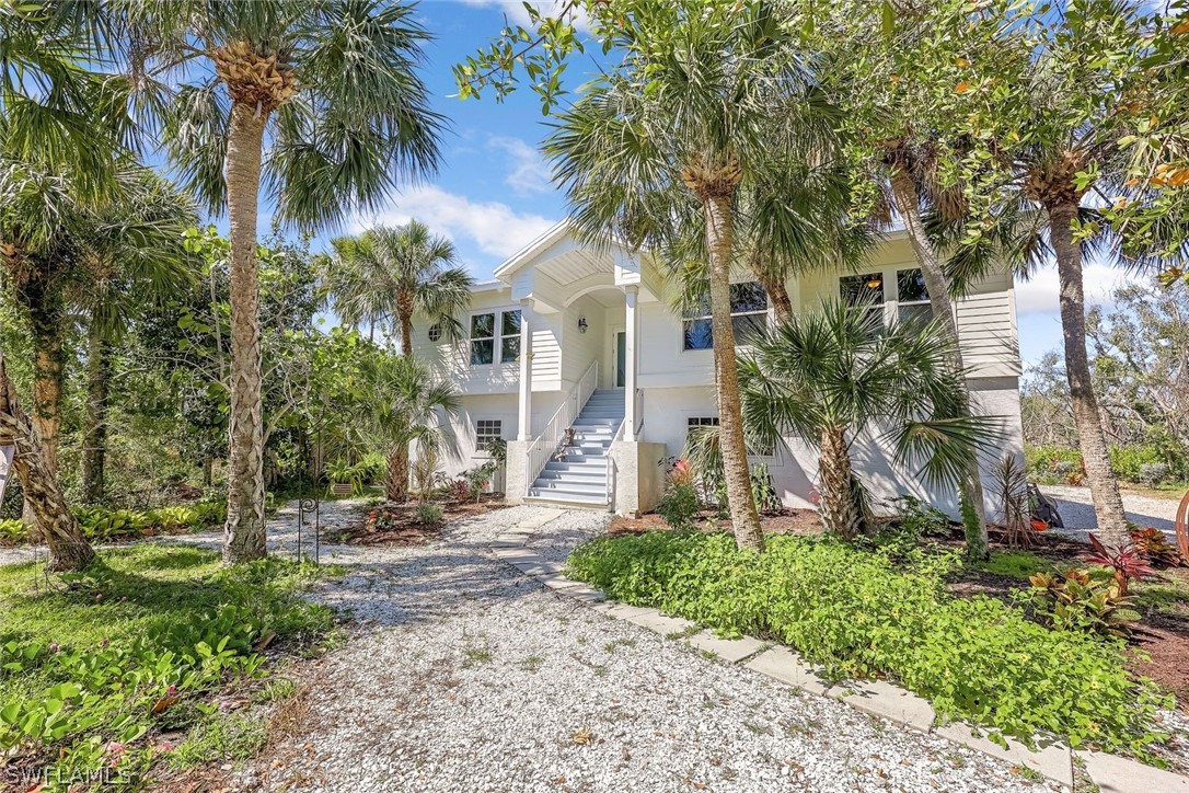 Enjoy privacy and quiet in your Sanibel Island oasis. This 3 bedroom plus den, 2 bathroom home is just what you have been looking for. With a new roof, new impact windows and new Hardie plank siding, this elevated home has it all. The oversized pool has a new, full house height screen enclosure surrounding the large pool and an 8 person hot tub. Ample room for entertaining both inside and out. The home backs up to SCCF preserve land and is set well back from SanCap Road so is super quiet. Inside the kitchen has new stainless appliances and granite counters that opens to the living room. A separate, large dining area is ready for entertaining family and friends. The low insurance costs are reflective of the resilient structure of the house. You won't want to miss this opportunity just a short walk or bike to Bowman's Beach and a quick bike to the JN Ding Darling Refuge. (virtual tour coming soon).