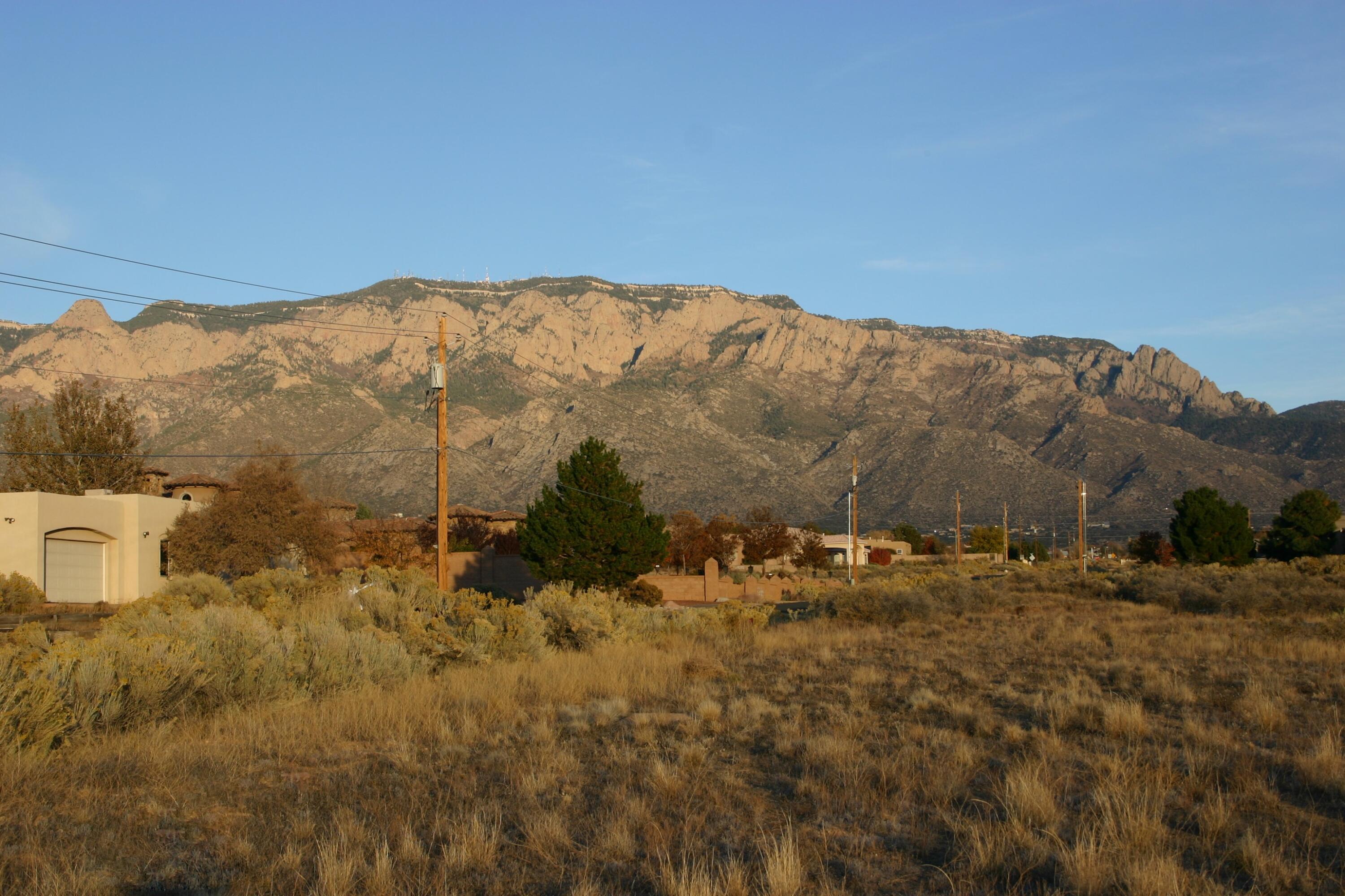 Rare opportunity within the City of Albuquerque Boundaries in the Far Northeast Heights, 4 lots in a row.  Excellent investment play, pressures of growth along with proposed upstream improvements could make a future payday, or tackle a small development now.   Westerly lot excellent home site, hold the other three.  Lots of options!   City Water and Sewer a few lots away.   Has floodplain impact to address if using in the short term.  Proven long term investment.   Make your offer.