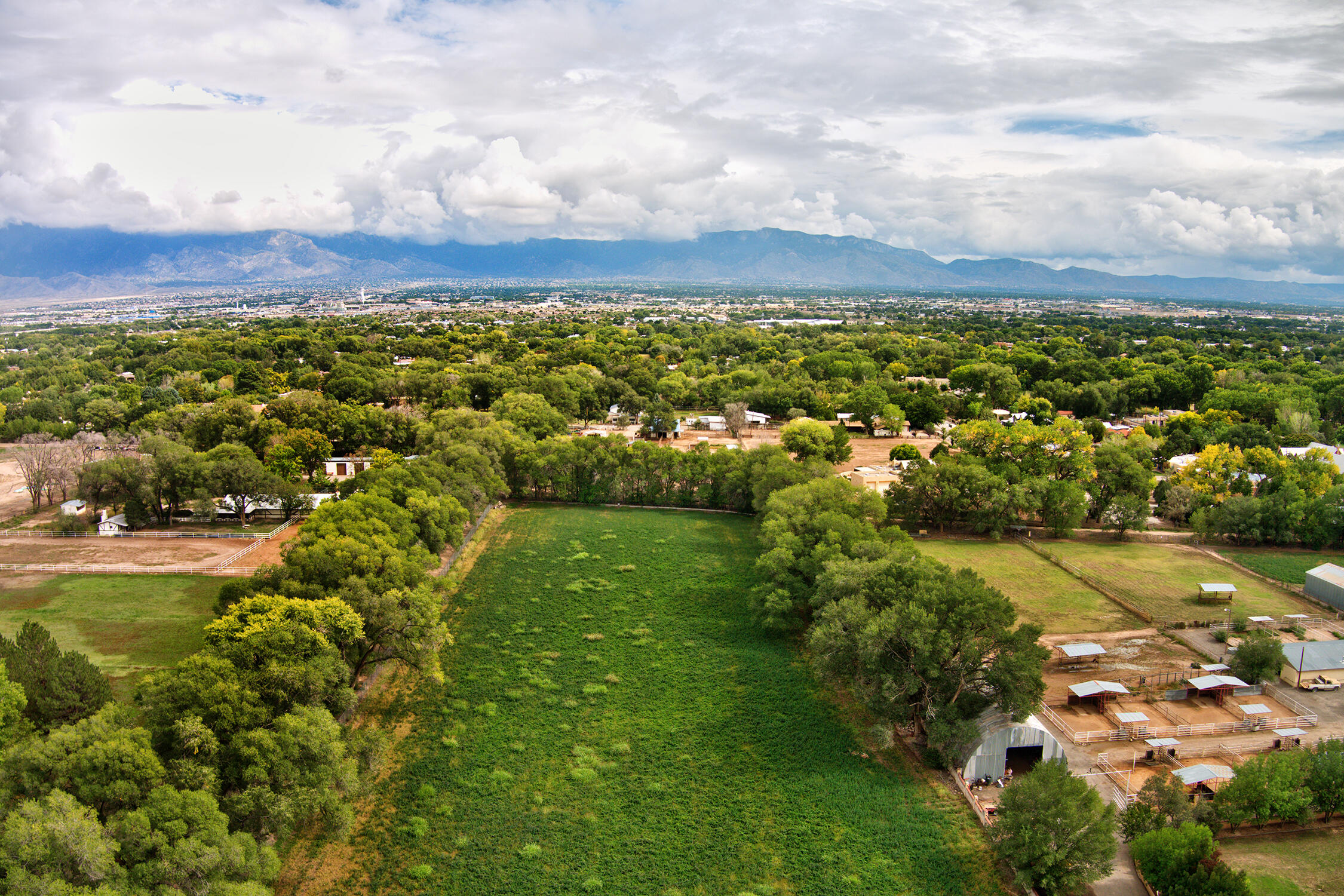 Property is in final stages of a lot split with MLS #1058215.  New access road will be at north end of property to benefit east lot.   Parcel is lined with mature trees, pipe fence.  Property can be irrigated from the MRGCD.  Owner financing available.