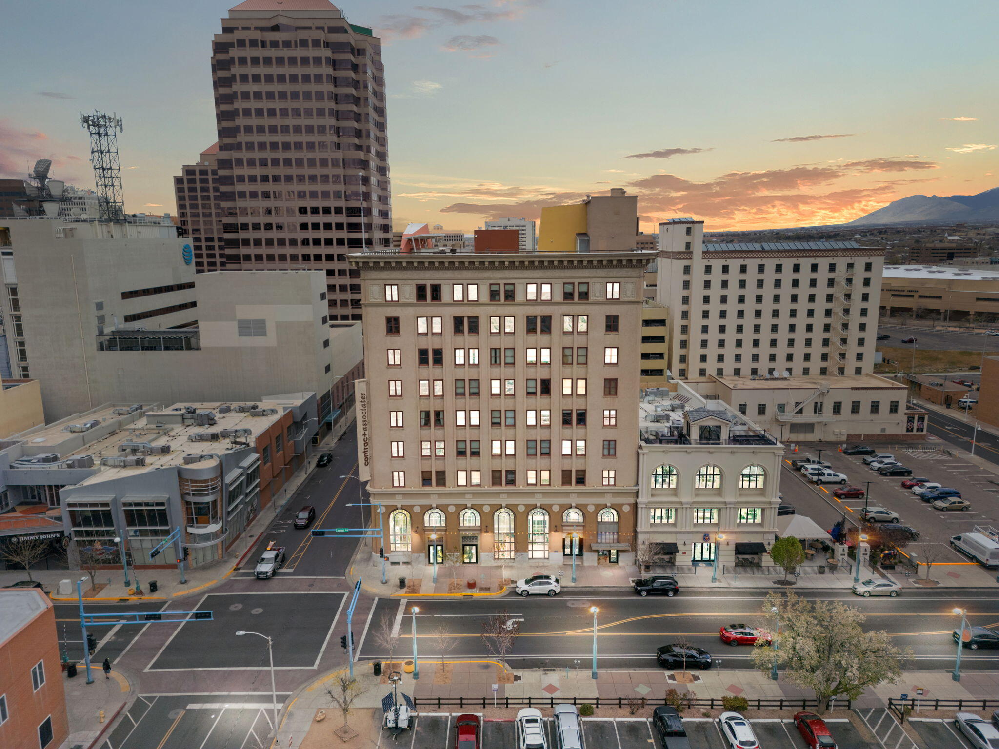 This charming 2BR/2.5BA residence in downtown Albuquerque's central business district spans 1,711 SqFt, blending modern amenities with historic charm. Enjoy nearby dining, shopping, and entertainment, with security ensured by a dedicated guard and secured elevator access. The kitchen boasts a stylish island with bar seating, stainless steel appliances, granite countertops, and ample storage. Additional features include exposed ceilings, track lighting, tile flooring, refrigerated air, ceiling fans, and a fireplace. The master bedroom offers a walk-in closet and ensuite bathroom with a double sink vanity, separate shower, and freestanding tub. Step out onto the upper-level balcony for city views. Call today to schedule your exclusive showing and experience the allure for yourself!