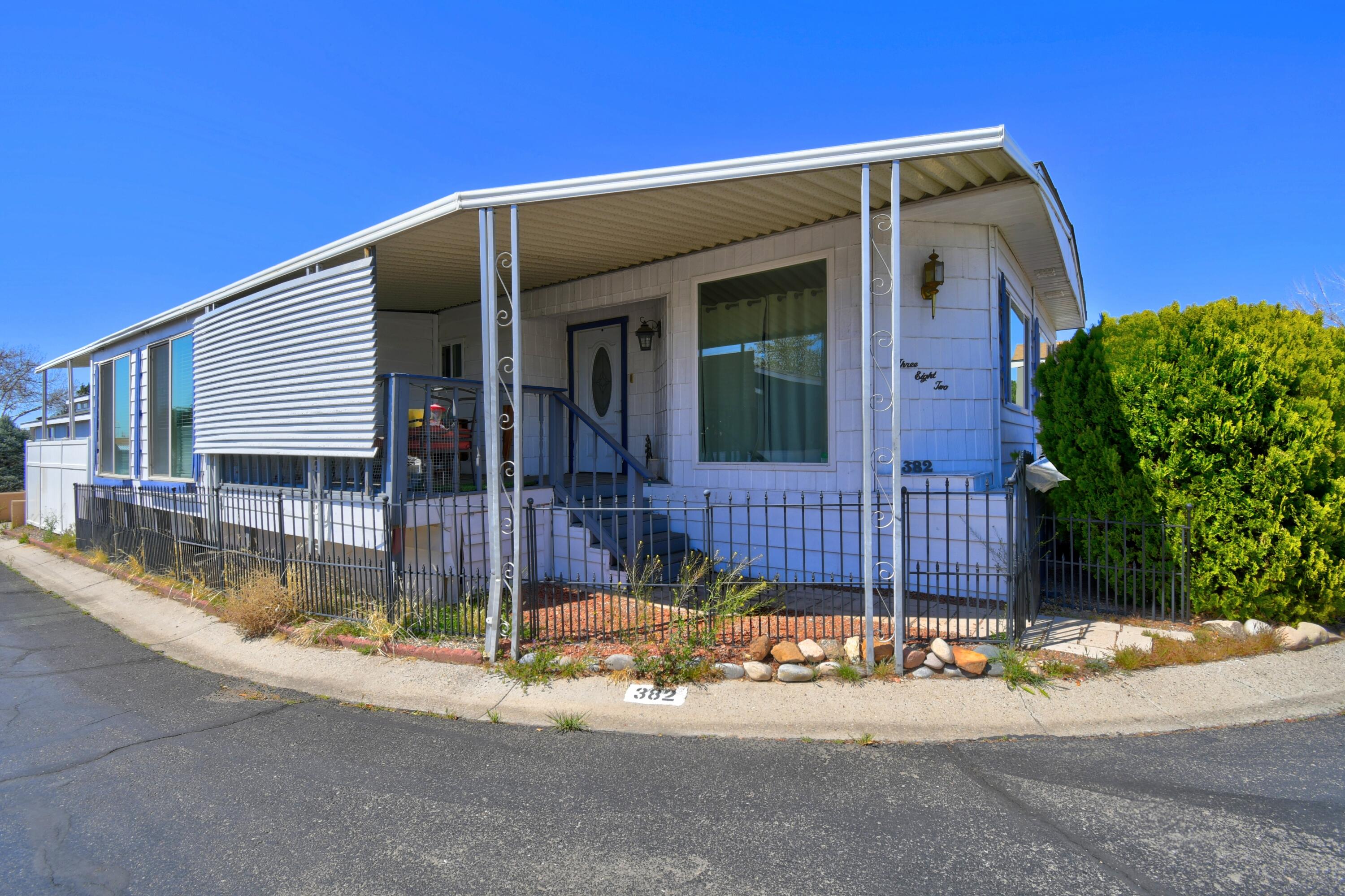 Welcome Home! Enjoy fabulous amenities in the bustling 55+ community of Albuquerque Meadows! This home boasts 2 living areas, refrigerated air, hot water recycling pump, and 5 large ceiling fans.  The kitchen was updated in 2021 with new cabinets, granite countertops, and stainless steel appliances.  The roof was reroofed in 2022. Also has a storage shed with electricity. Albuquerque Meadows features an inground pool, hot tub, community center, and walking trails for the residents enjoyment.