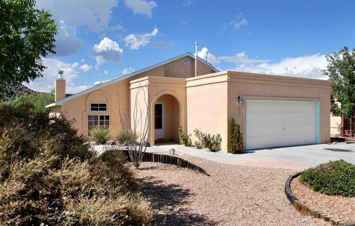 ** Motivated Sellers ** Located in the Santa Fe Village neighborhood, this lovely 3 bedroom home has a large greatroom with vaulted ceiling and gas assisted wood burning fireplace with stacked stone. Oversized upstairs master suite is separate from other rooms. It has a bath with two sinks, tub and separate shower, walkin closet and a private balcony with views. Home has spacious rooms including loft and office, lots of storage space, ceiling fans throughout, LVP and tile floors and newer custom metal gates. All appliances convey. Landscaped front and backyard with covered backyard patio. Walking distance to park, library and dog park.