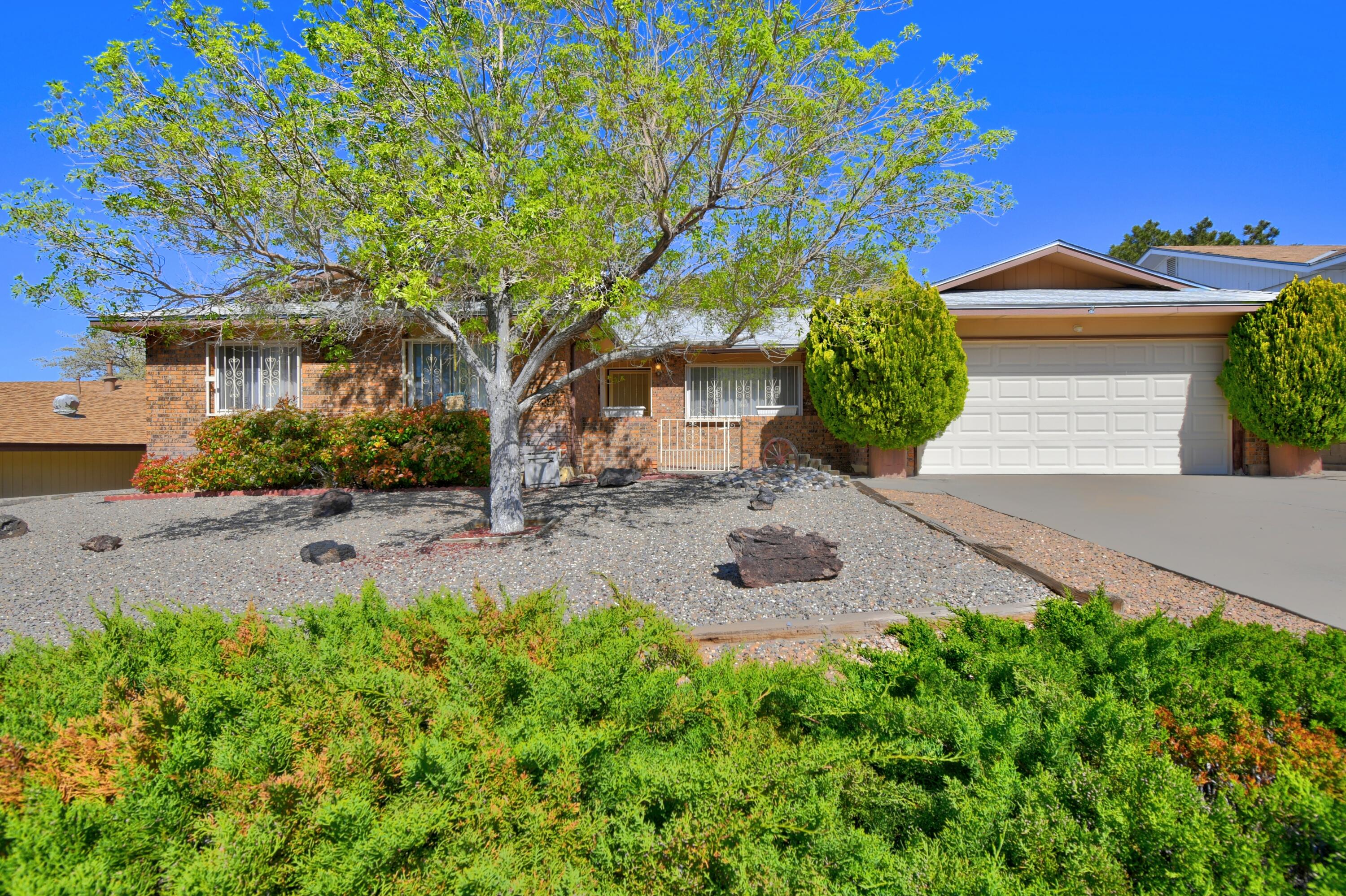 Nestled in the serene Foothills South area, this 1889 square foot gem offers four bedrooms, two baths, and a prime location by the Sandia Mountains. Immaculately kept and move-in ready, it boasts quick access to walking and biking trails. The beautifully landscaped yard invites outdoor enjoyment, while inside exude warmth and charm. Experience the perfect location home in this tranquil mountain retreat. Carpet has been replaced with luxury vinyl floor. Welcome home!