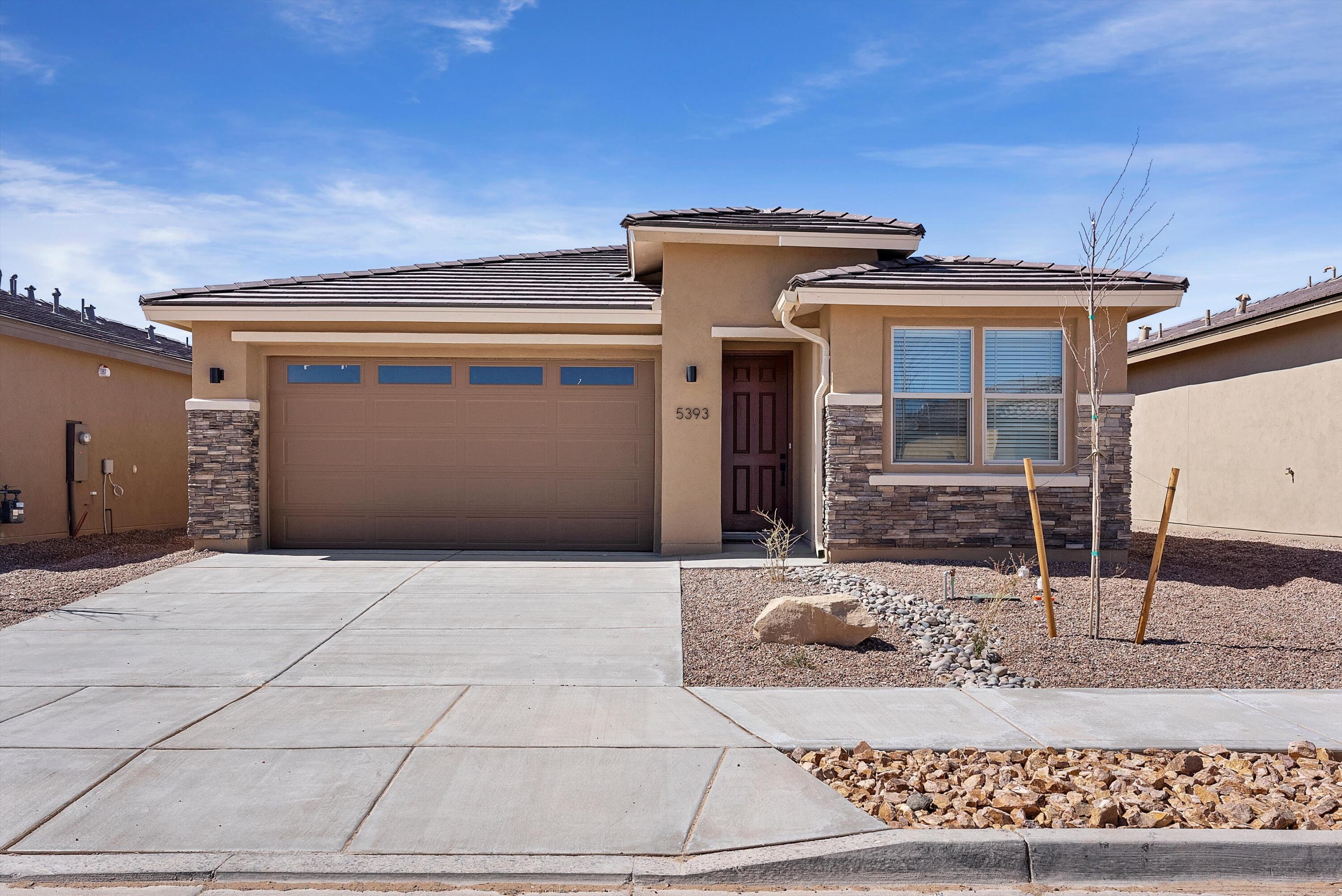 Welcome to this stunning Sapphire home, ready for quick move-in! Included features: a covered entry; a spacious great room with added windows and center-meet doors leading onto a covered patio; a dining nook; a well-appointed kitchen boasting white 42'' cabinets, a center island and a generous pantry; a convenient laundry; a lavish primary suite showcasing extra windows, dual walk-in closets and a private bath with double sinks; three secondary bedrooms and two additional bathrooms. This home also offers quartz countertops, luxury vinyl plank flooring and stone exterior accents. Tour today!