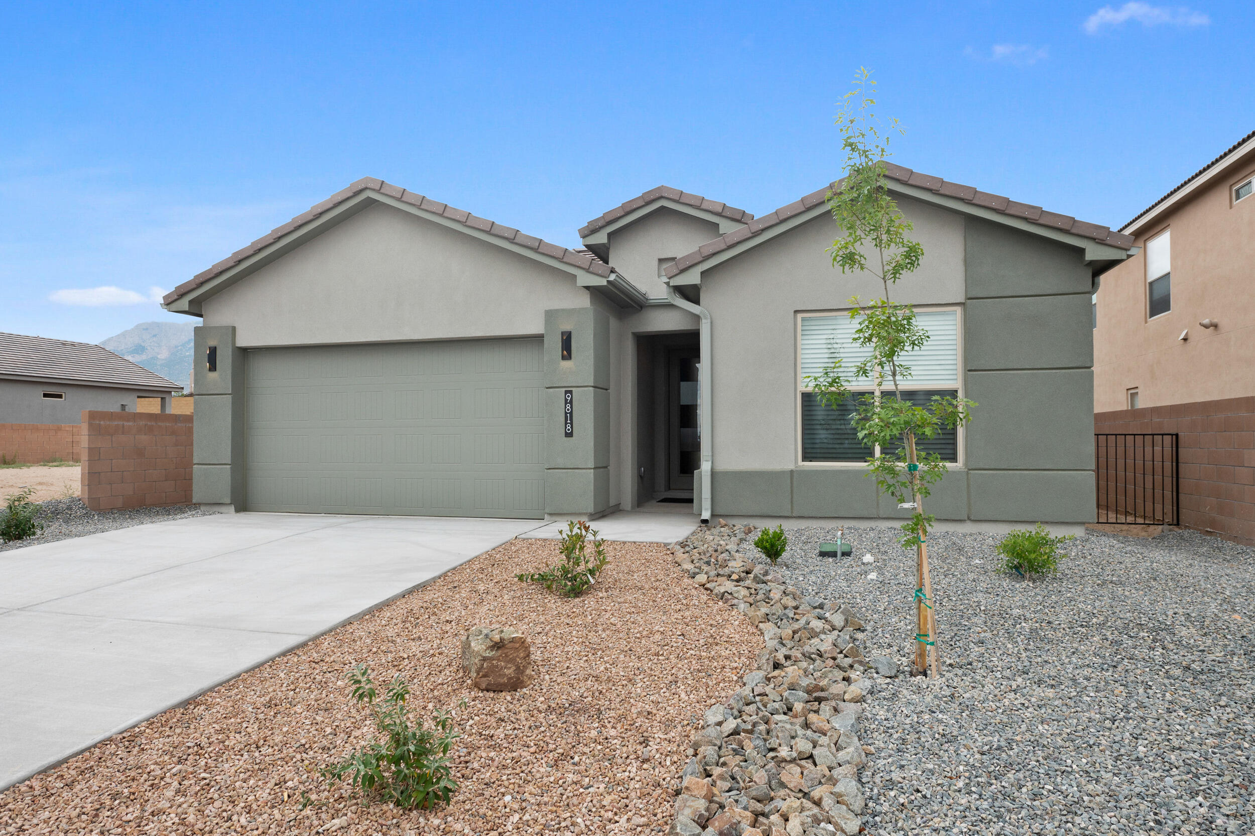 In the heart of North Albuquerque acres, enter into the tree lined parkway of Palomas Meadows! Brand new gutters, Deako Smart Switches, Window Screens, & Lift master opener. Just minutes from Trader Joes, restaurants, shopping & recreation. Splendid Views of the city and Sandia Mountain out your doorstep, porch and patio. Contractors just putting finishing touches on this new construction by DR HORTON. 3 bedrooms and an office/flex room 2 full bath rooms and powder room. Gourmet kitchen with in-wall stacked oven & microwave, huge corner pantry, Quartz countertops under tall Grey cabinets, pendant lighting over island, 8 foot doors throughout home. Primary suite has both glass shower and luxury soaking tub. Energy efficient and smart home connected.