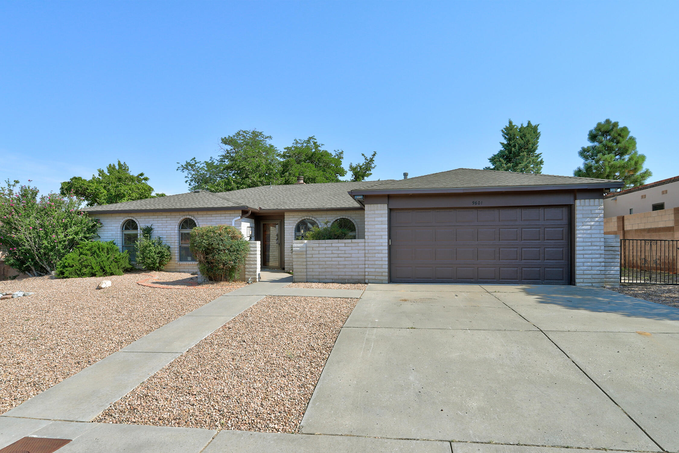 Welcome to your dream home! This stunning 4-bedroom, 2-bathroom residence has been beautifully remodeled. Inside this home, you will find new flooring, fresh paint, new lighting fixtures, and a gorgeous kitchen remodel, including new quartz countertops, a farmhouse sink, a new refrigerator, and dishwasher. The bathrooms are also updated, and to top it all off, a brand-new roof. Filled with natural light, this home features a cozy fireplace and a large backyard with breathtaking views of the Sandia Mountains. Nestled in one of the most sought-after neighborhoods, with some of the best public and private schools nearby, this home offers a perfect blend of modern amenities and timeless charm, All you need to do is move in. You won't want to miss this one!