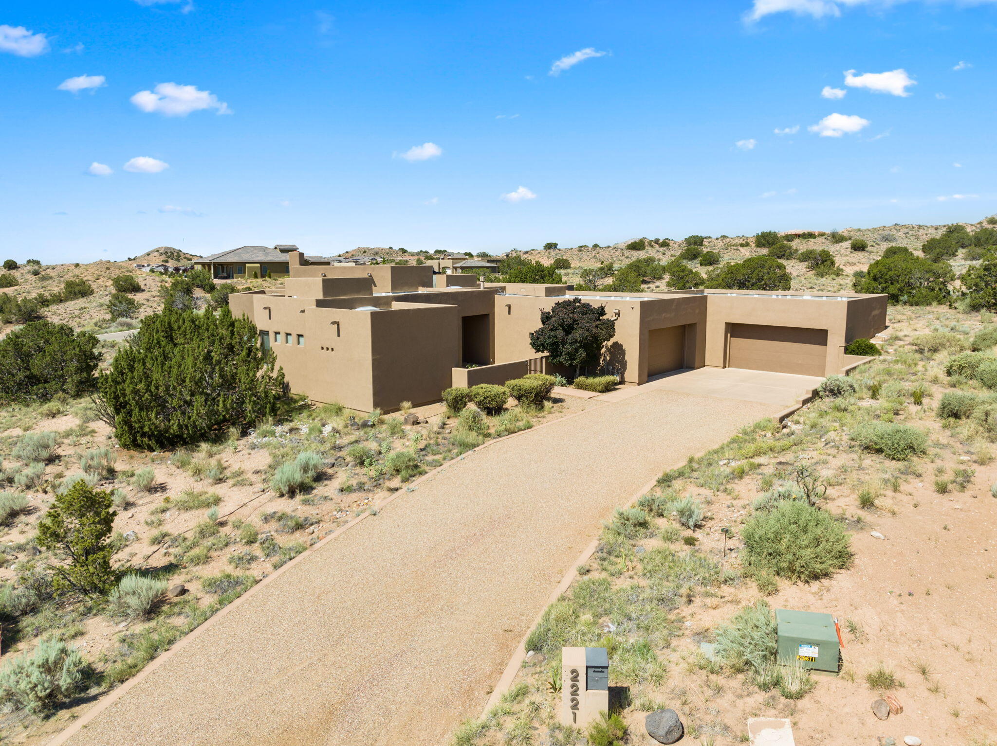 This contemporary custom built home sits on 1.5  acres in the enchanted southwest community of Mariposa. This home captures the golden glow of sunrise and the rosy hue of sunsets. Every day feels like a retreat in this 2663 ft. with three BR, three baths on a quiet cul-de-sac. Enjoy the spa-like primary bath. The gourmet kitchen  will suit all your entertainment needs with comfort & style. Skylights & big windows will wrap you in the beauty of natural light. You are surrounded by open space with access to hiking & mountain biking trails right out your own back door. A large 1695 ft. garage is ideal for a workshop, hobbies or storage.  Relax with amazing Mountain views, dark skies & twinkly city lights. The Mariposa Community Center offers two pools & a full gym.