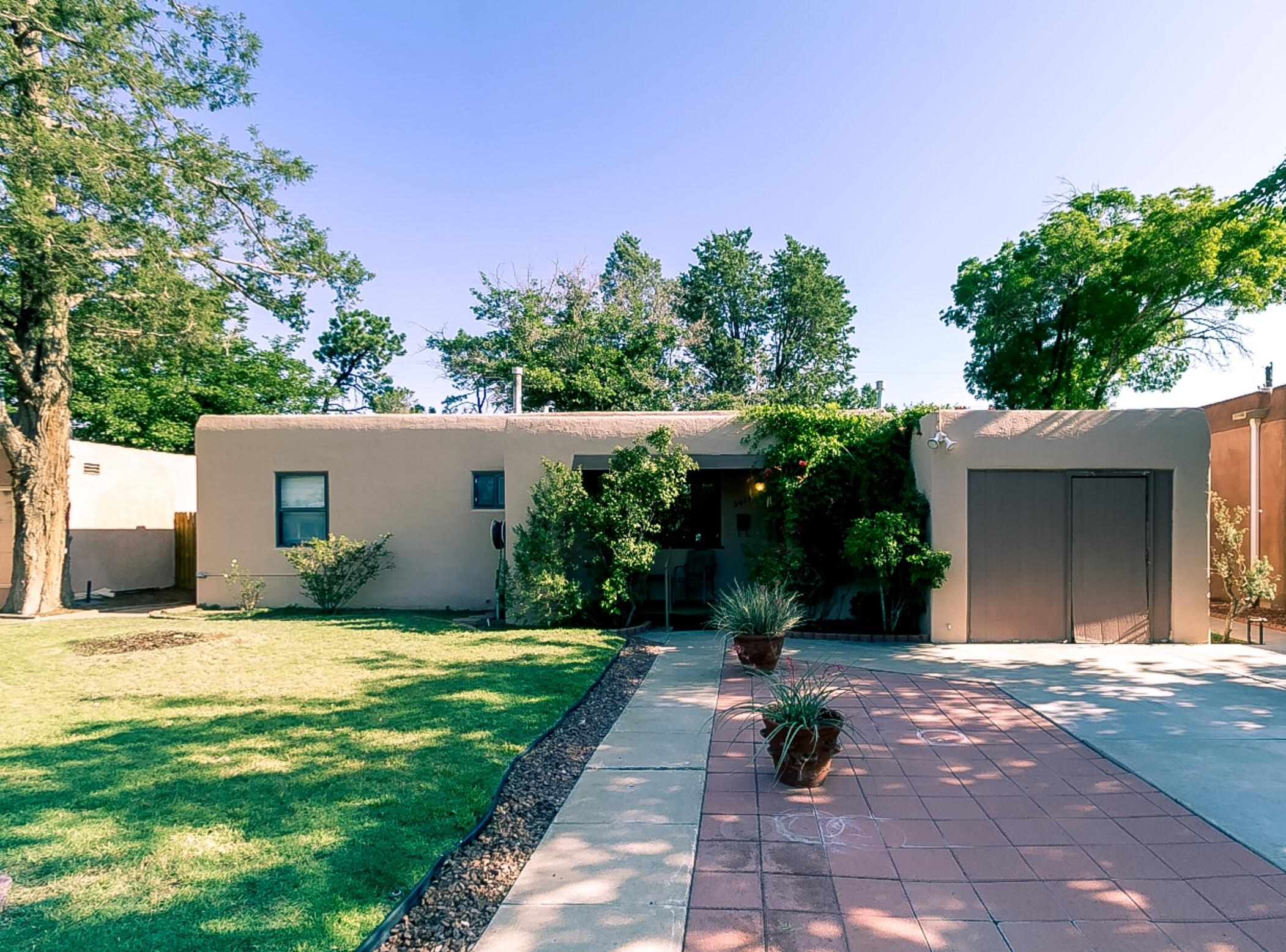 One level home in Loma Vista near UNM and Nob Hill! One owner for the last 70 years! Believed to have hardwood under carpet in the original part of the home. Three large bedrooms + office/study (or 4th bedroom). One full bath + one 3/4 bath. Living and dining rooms with coved ceilings. Large den with fireplace. Kitchen with gas cooktop, double ovens, pantry and breakfast nook. Lots of built-ins and ceiling fans. Refrigerated air. Garage was converted to storage. Front porch, covered patio +  lawns front and back. Detached backyard storage/workshop with electrical service. Mature, established neighborhood close to law/med schools and golf!