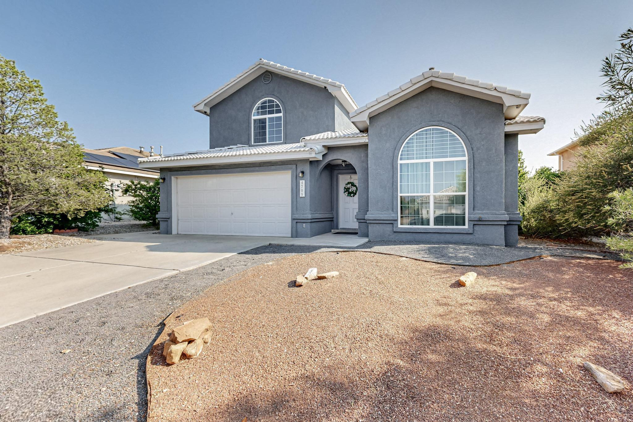 This fabulous updated 5 bedroom home is just waiting for you and your family! There is one bedroom on the main floor with access to 3/4 bath. Perfect for a mother in law suite.Updated tile flooring downstairs. Updated luxury primary  bath. New quartz countertops in the kitchen. Plenty of room for the whole family. Enjoy the views of the Sandia Mountains from the upstairs Primary. The gas fireplace will keep you toasty in the winter months. Easy maintenance backyard means very little backyard chores.