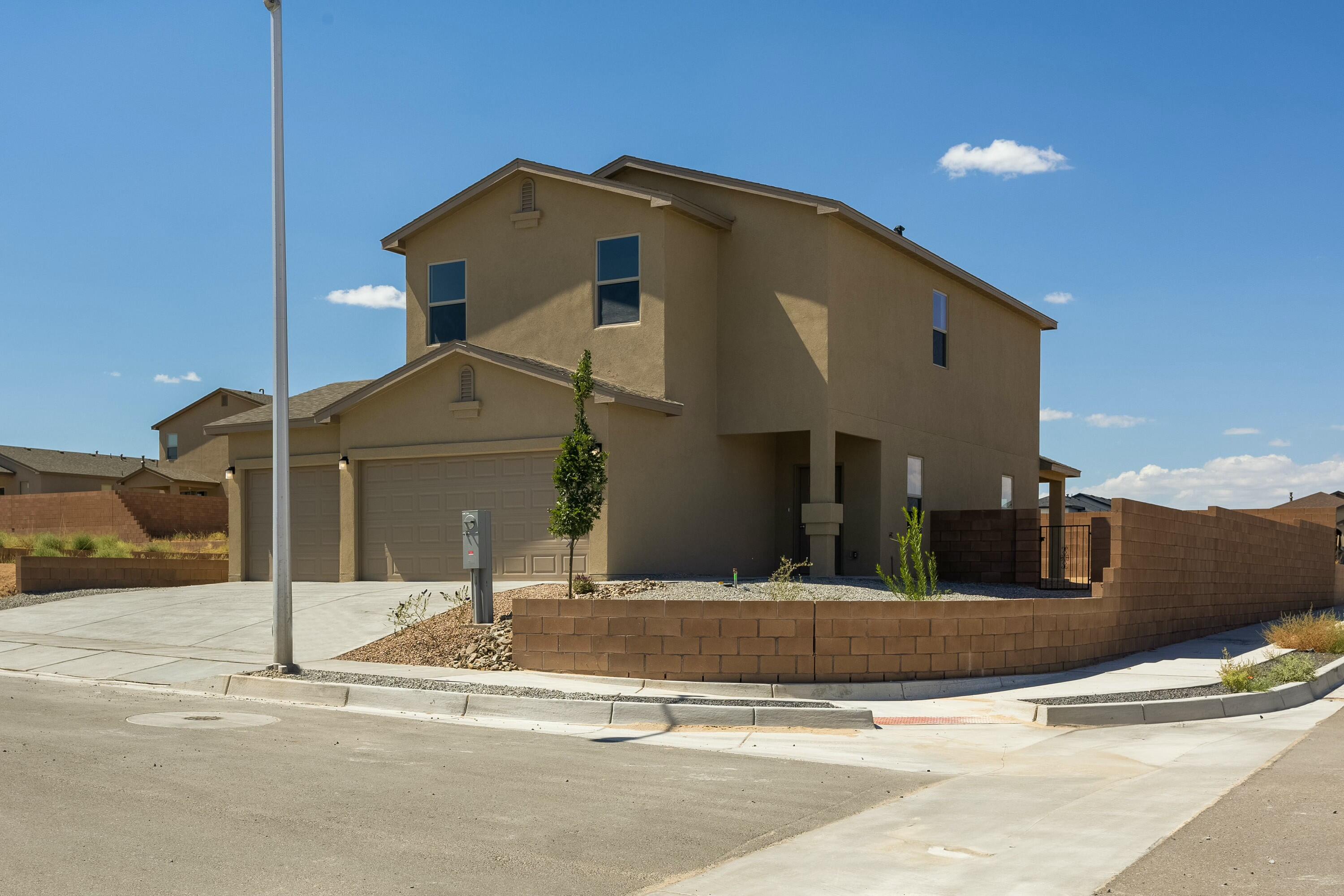 3 CAR Garage! close proximity to shopping and services-a minute to 550 and a few more to I-25 yet away from the hustle and bustle of city life. Mountain Hawk is less than 30 min. to Abq and less than an hour to Santa Fe. Welcome to Twilight's BEST VALUE collection, the Onyx floorplan designed for busy folks who like the extra space this home offers. With it's 3-car garage, large 1st floor and remarkable upstairs it's an amazing home. The spacious yard is great for entertaining and play. The home comes with multiple warranties so come in today and make it yours! Pics are of the model. Actual colors and selections may vary. You may be able to customize if you come in soon.