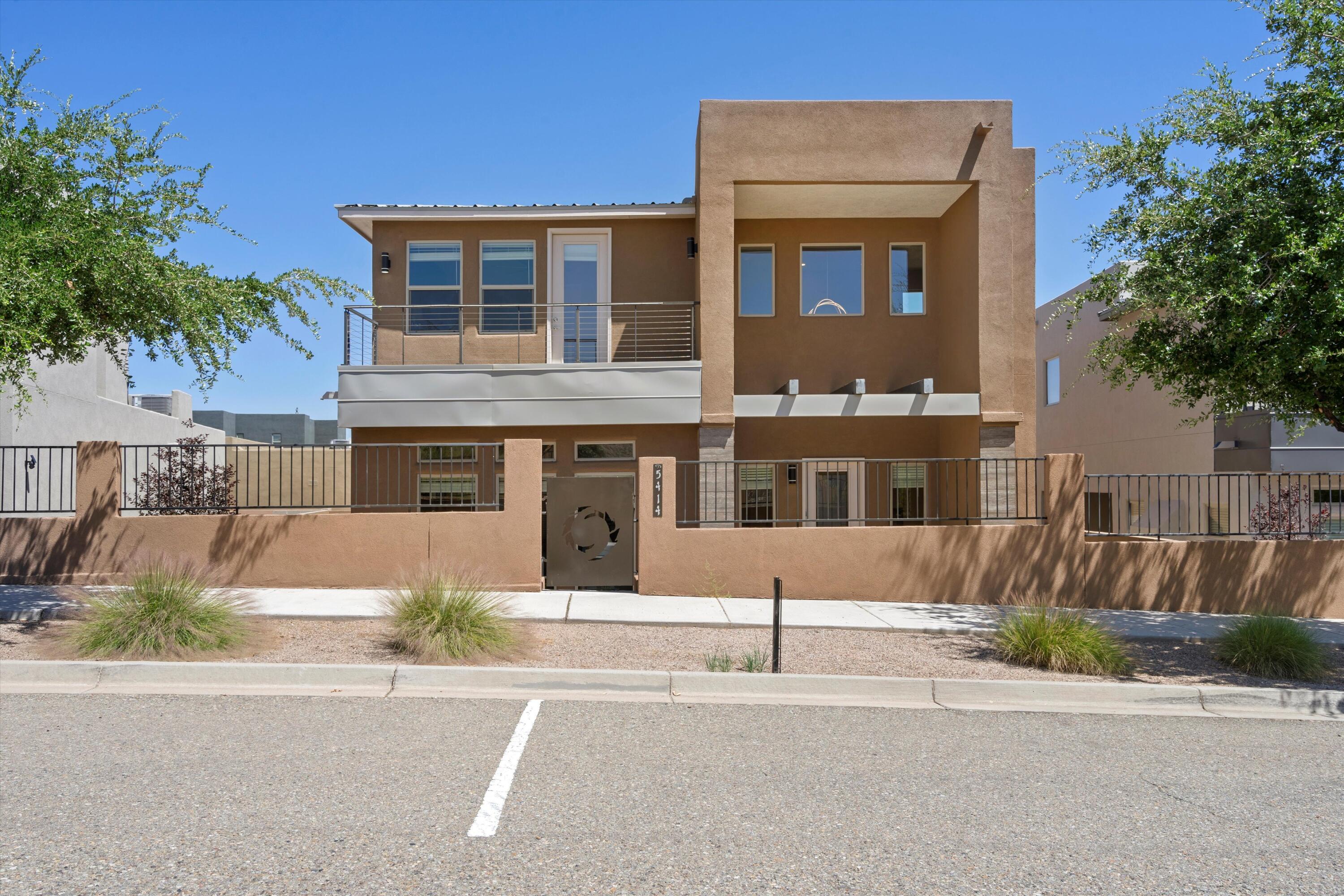 AN ABSOLUTE MUST SEE! This elegant 2-story home in Rio Rancho's desired Mariposa community is a lifestyle upgrade. With 4 spacious bedrooms and 4 baths, this residence features a gated entrance, open living/dining area with custom fireplace, modern lighting, and sleek tile flooring. The gourmet kitchen with an island is perfect for culinary adventures. Great for multigeneratonal living with two master suites--one upstairs, one downstairs--both with luxurious bathrooms and adiditionally a laundry room on both floors! Enjoy stunning mountain and city views from your backyard patio. Explore nearby trails, pools, gym, and the soon-to-open neighborhood restaurant. This home offers more than just living space--it's a lifestyle! Contact a Realtor for a full list of upgrades and features!