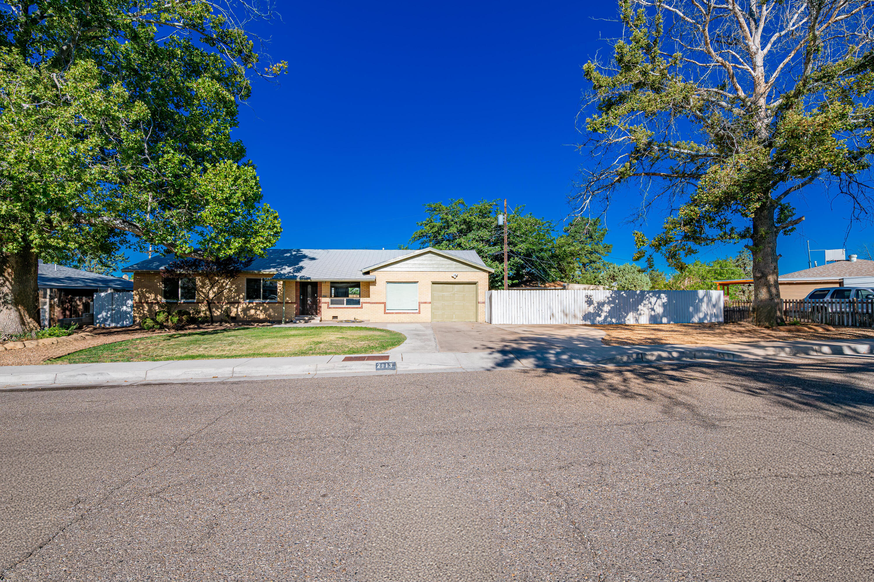 1 YEAR HOME WARRANTY INCLUDED! Less worries for buyers with full home warranty at wonderful home in sought after Hoffmantown near ABQ Uptown. 4 spacious bedrooms and 3 full bathrooms on huge lot5 with so much potential! 4th bedroom with its own ensuite bathroom and separate entrance is perfect for in-law suite, grown kids or air b&b! The home boasts refinished original oak flooring and stylish new recessed LED lighting with dimmers throughout, enhancing the contemporary feel. The kitchen has been thoughtfully upgraded with brand new granite countertops making it both functional and inviting. Hot tub ready with new 50 amp breaker. This is your new home!