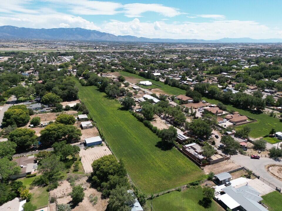 Fabulous opportunity to own a prime piece of property in the North Valley. Home has potential access from 4th and access on SW end of property on Guadalupe Trail.  Could be your own estate or possibly subdivide into smaller parcels. Property has ditch irrigation rights with the MRGCD. Check with Bernalillo County in regards to subdividing.