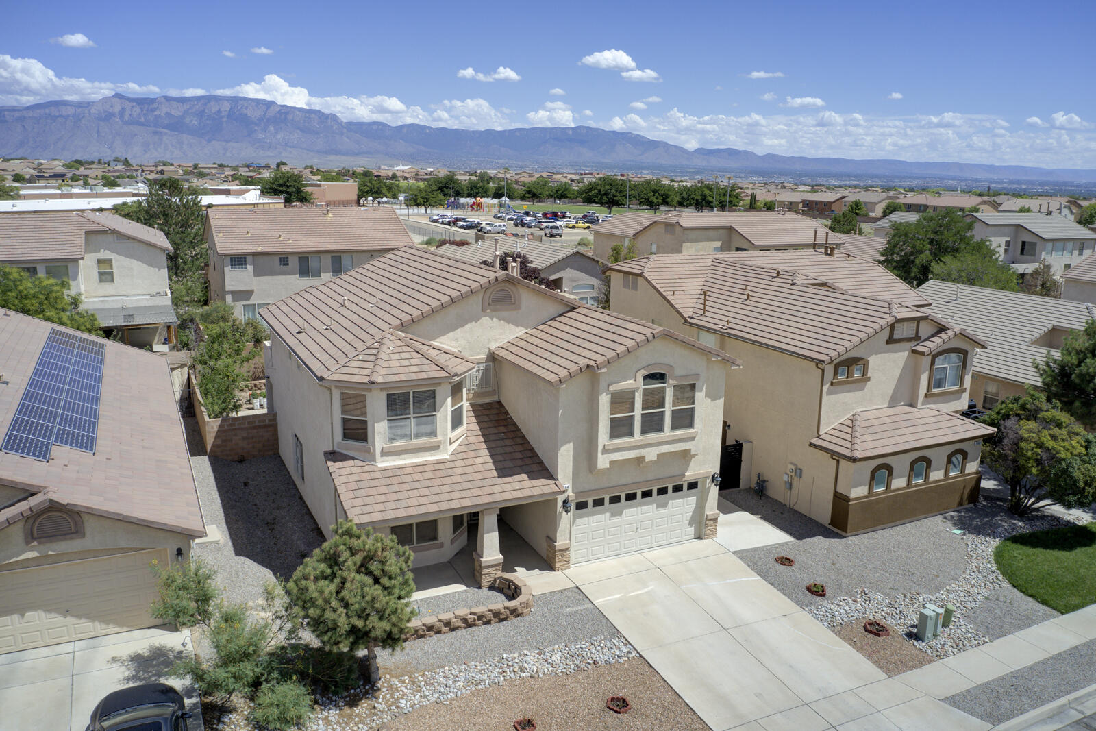 Dream Home Alert! Discover this stunning 2-story home, nestled in the desirable Cabezon community. Enter this exquisite 4-bedroom, 3-bath home with numerous custom updates throughout, showcasing elegant wood, marble, and ceramic flooring. The spacious kitchen features custom granite countertops, and a large pantry.  Cozy up by the custom fireplace in the inviting living area. Bright big dining room perfect for entertaining. Upstairs the Maine suite boasts a private Balcony and luxurious bathroom with walk in closet.  Covered back patio for outdoor gatherings. Private fenced yard. Beautiful parks and activities just a short walk away.