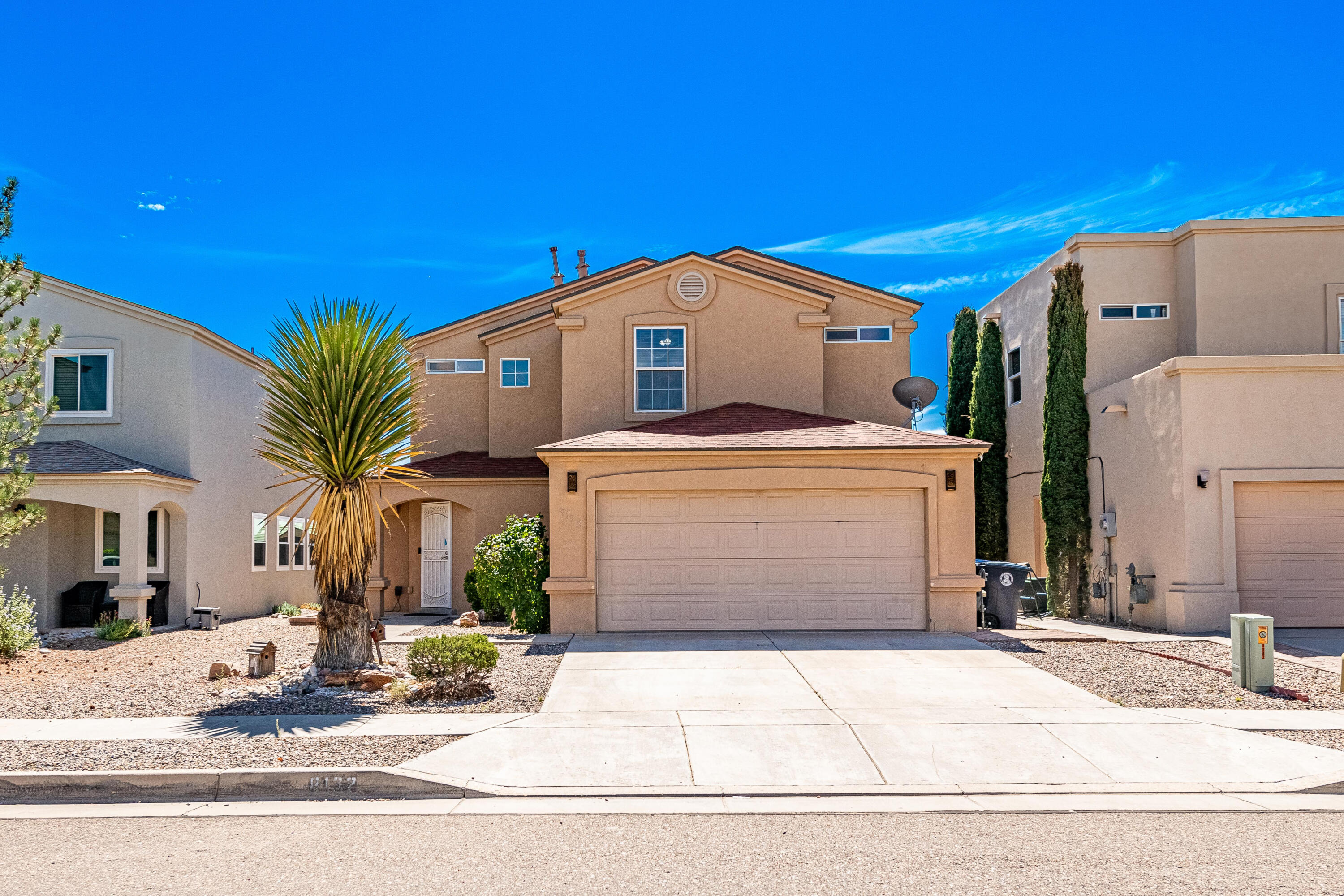 Welcome Home to this inviting three bedroom two and a half bath home that is perfectly perched in the Eagle Ridge Subdivision capturing unparalleled views of the Bosque and the Sandias. The heart of the home boasts a beautifully updated kitchen, featuring gleaming granite countertops and elegant stone tile accents that seamlessly flow into the spacious great room. Upstairs you will find a bonus area leading you into the three ample sized bedrooms.  The balcony off the primary allows for a private retreat with views that will leave you in awe every day.  The spacious yard comes complete with low maintenance artificial turf and a covered patio providing all the comfort and desired space without the hassle.Schedule your private showing today!