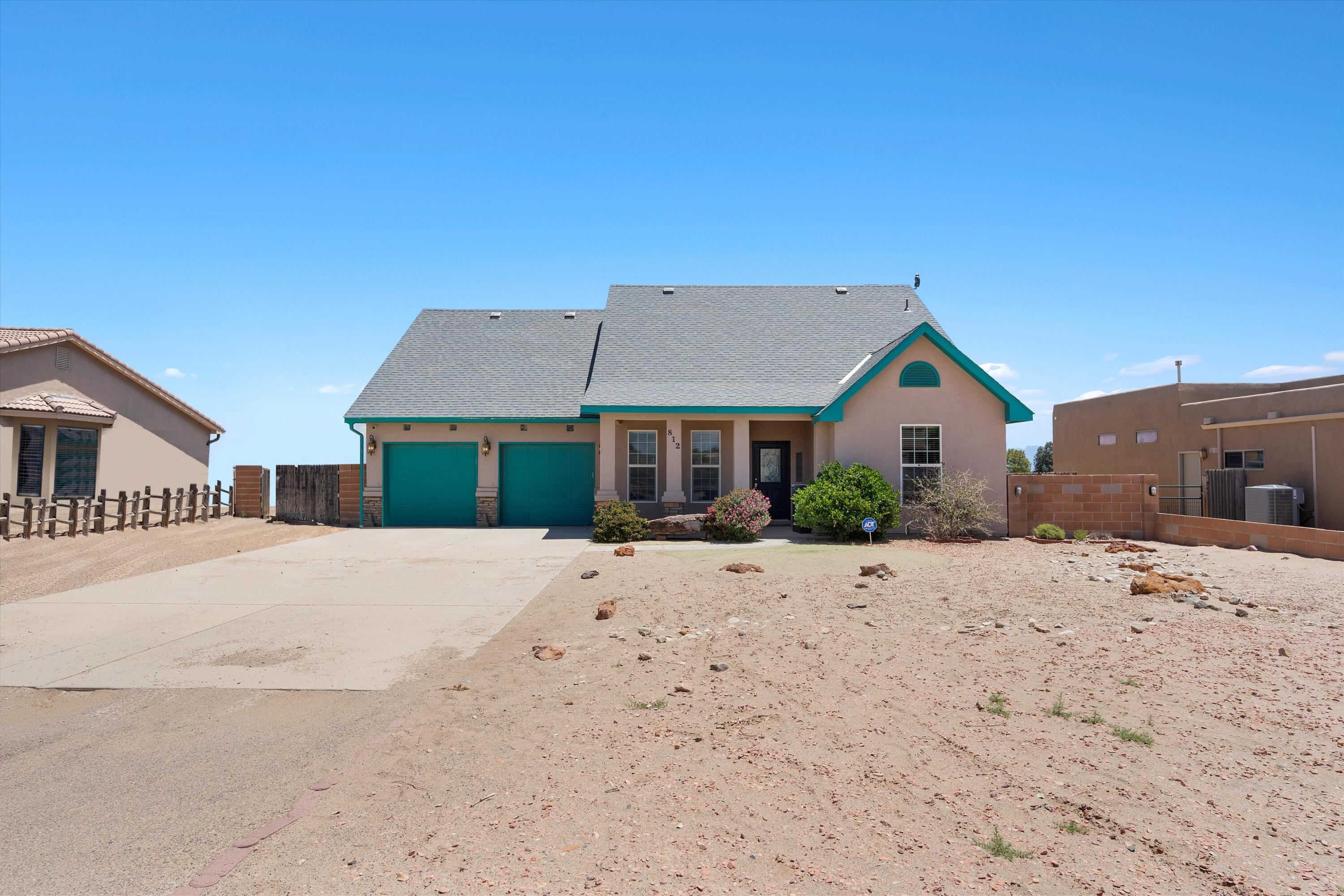 PRICED TO SELL and SELLER OFFERING $5K TOWARD BUYERS CLOSING COSTS. Captivating custom-built 3-bedroom, 3-bathroom home with Bonus room sits on a spacious half-acre lot with stunning views of the Sandias. The primary suite boasts a generously-sized walk-in closet, a luxurious bathroom with a jetted tub, separate shower, and double sinks. Upstairs, a bonus room awaits with its own large walk-in closet, a bathroom featuring a Jacuzzi tub and separate shower, and a balcony offering picturesque views. On the main level, you'll find a formal dining room, a kitchen equipped with stainless steel appliances. The open floor plan seamlessly connects an eating bar and a cozy living space with a gas fireplace. Step outside onto the covered back patio to relax in the hot tub while soaking in