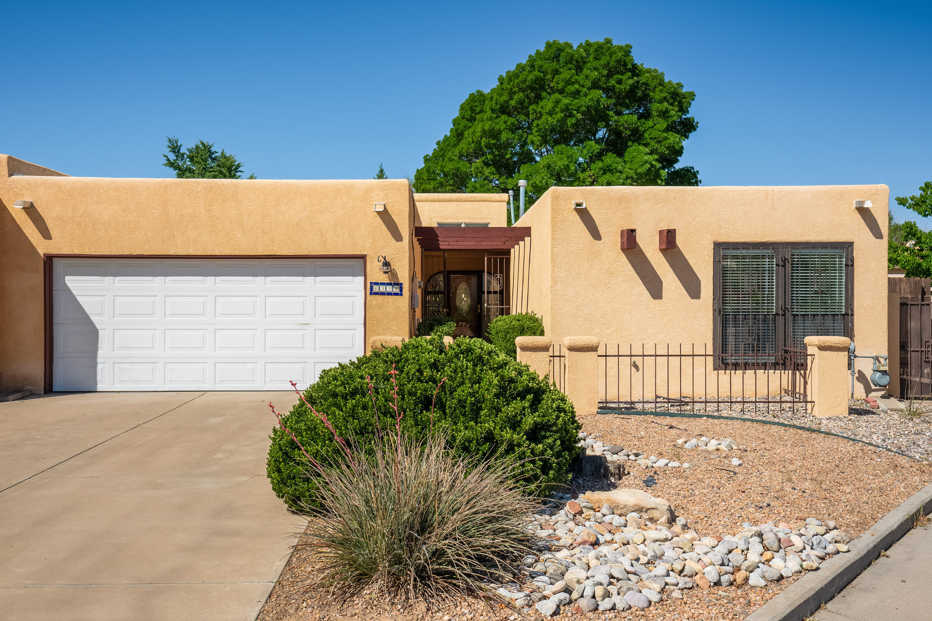 You will fall in love with this Northeast Heights gem, showcasing an exquisite remodel with thousands of dollars in quality upgrades & fine appointments throughout! A courtyard entry leads you to the stunning entrance. Discover an open floor plan with generous spaces for relaxing & entertaining! 3 Spacious bedrooms plus a study! Gorgeous remodeled kitchen & bathrooms with NEW cabinets, (including laundry room), NEW granite counter tops, NEW faucets & sinks, NEW kitchen appliances, NEW lighting throughout, NEW electrical switches & outlets, NEW lighting to include ceiling fans in living room & master bedroom. NEW tile floors! Great room is enhance w/soaring raised ceiling & gas log fireplace. Double doors lead to game/hobby room with access to covered patio & LARGE backyard...more!