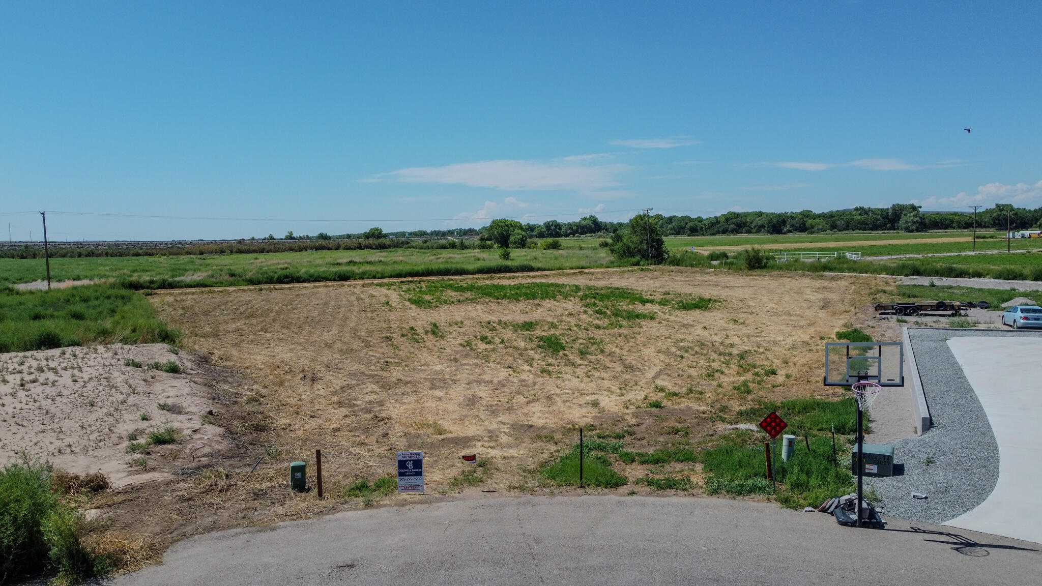 Looking for the perfect piece of land?  This 1.55-acre agricultural lot offers plenty of space and potential; to include valuable irrigation rights to the acequia.  Backyard access from ditch.  Home build needs to be 1800 sq ft or larger.  Pipe fencing only.  Can not obstruct views. This is a residential property; not commercial.