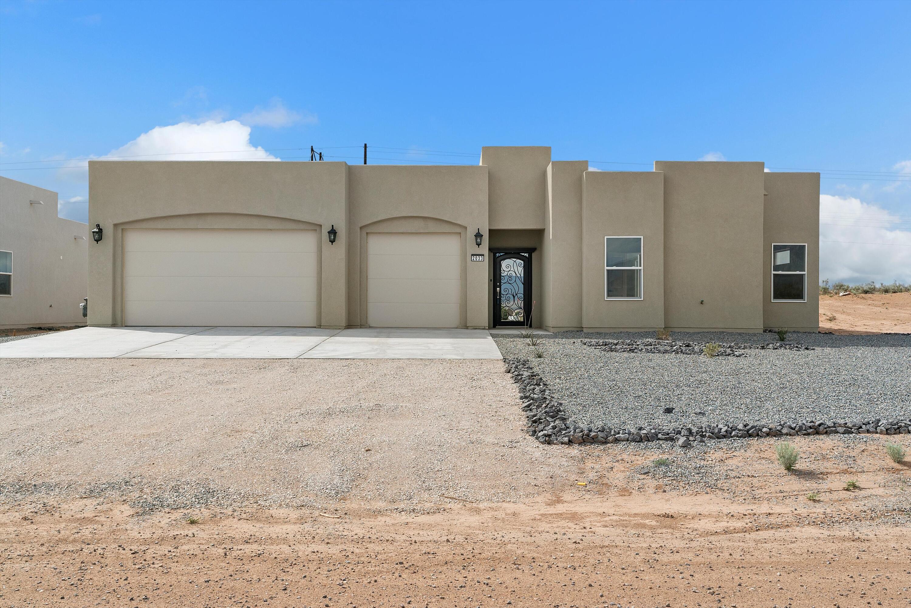 Custom home in Rio Rancho , vibrant beauty of the high desert! This newly constructed gem features 4 Br 4 BA 3 CG on 1/2 Acre with 2 master Bedrooms, a chef's kitchen with premium appliances, large kitchen island, walk-in Pantry . Open floor concept perfect for both relaxation & entertaining. Relax hang out in your own private courtyard. Located near Rio Rancho Event Center, UNM Hospital, and Intel, with seamless access to Los Alamos, Santa Fe and Albuquerque. Top-rated schools. Ideal for outdoor lovers, the area offers endless adventures, including walking, bike and ATV trails. New Block wall in back yard. Move in ready!