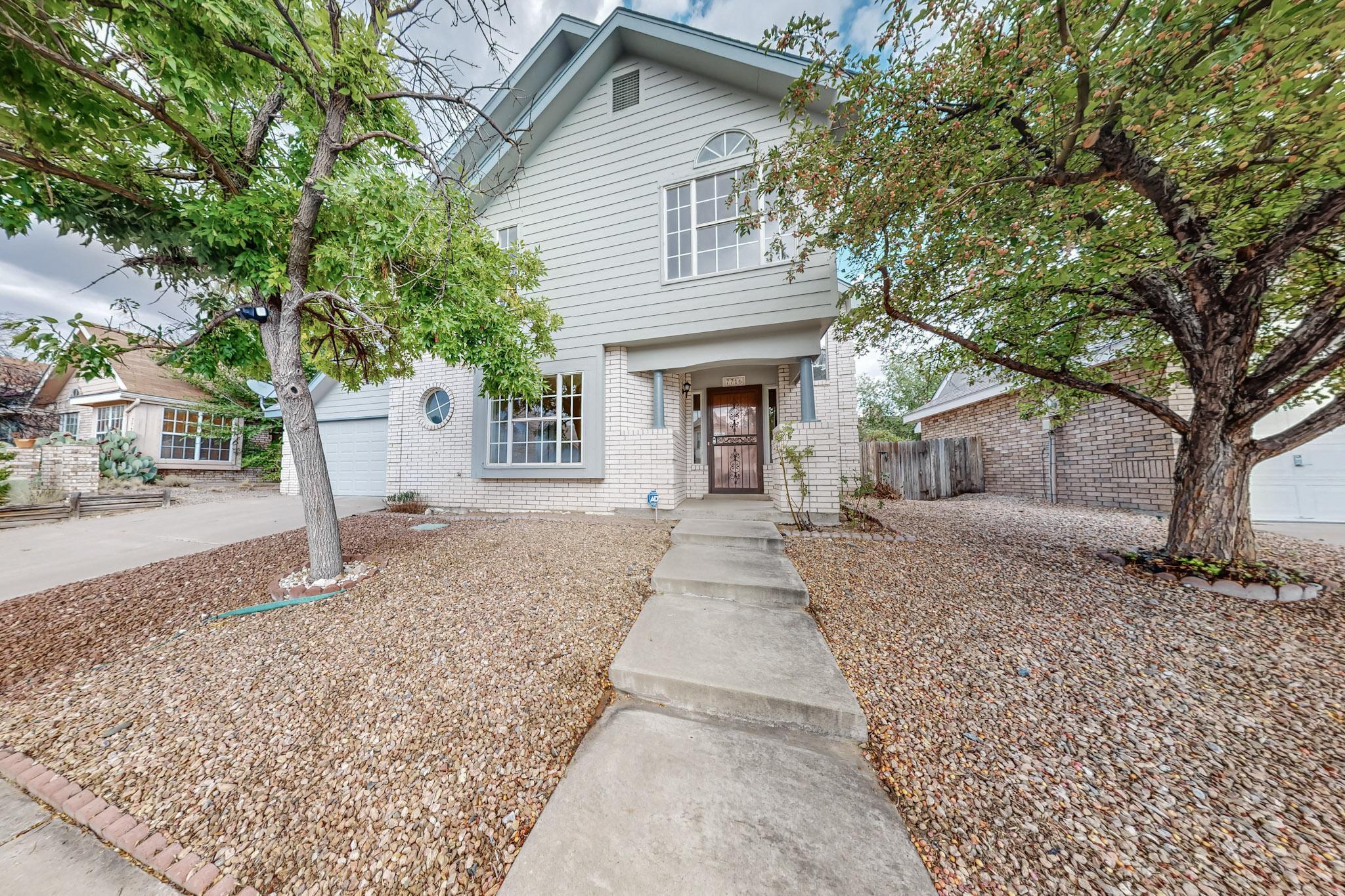 Discover the charm of this classic Sivage Thomas 2-story home, featuring 3 bedrooms, 2.5 bathrooms, and a spacious loft perfect for an office, playroom, or additional living space. The home offers refrigerated air, laminate wood flooring throughout, and tile in the kitchen, creating a seamless and stylish living environment. The kitchen is equipped with matching stainless steel appliances, while the wood-burning fireplace adds warmth to the living area.  Step outside to a charming backyard, perfect for relaxation.  The 2-car finished garage provides ample storage and convenience.  Located near all the amenities of westside living, shops, restaurants, schools, gyms, and parks.  Plus, you're within walking distance of the Petroglyph National Park and its scenic trails.  Roof replaced 2020