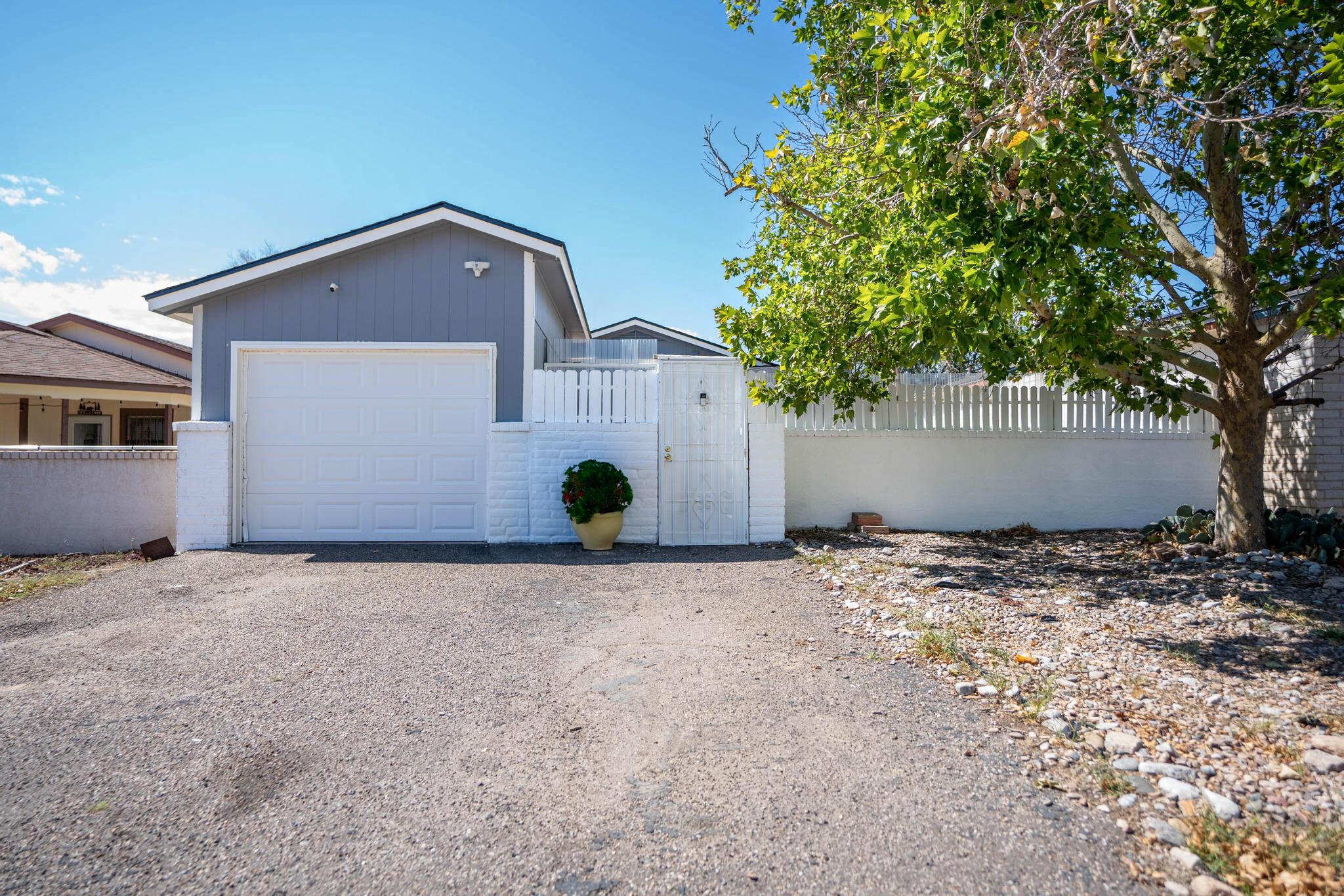 A must see, unique home in the prime location of Rio Rancho. With a brand new roof, you can ensure your peace of mind for years to come. Never run out of hot water with the new 40 gallon water heater, and stay cozy this fall with the Nest thermostat you can control from your phone and wood burning fireplace. Seller has taken pride and painted the exterior, installed stainless appliances and had the  polybutylene pipes replaced! The exterior offers privacy in the front and back yard, perfect for entertaining or enjoying New Mexico's beautiful weather.