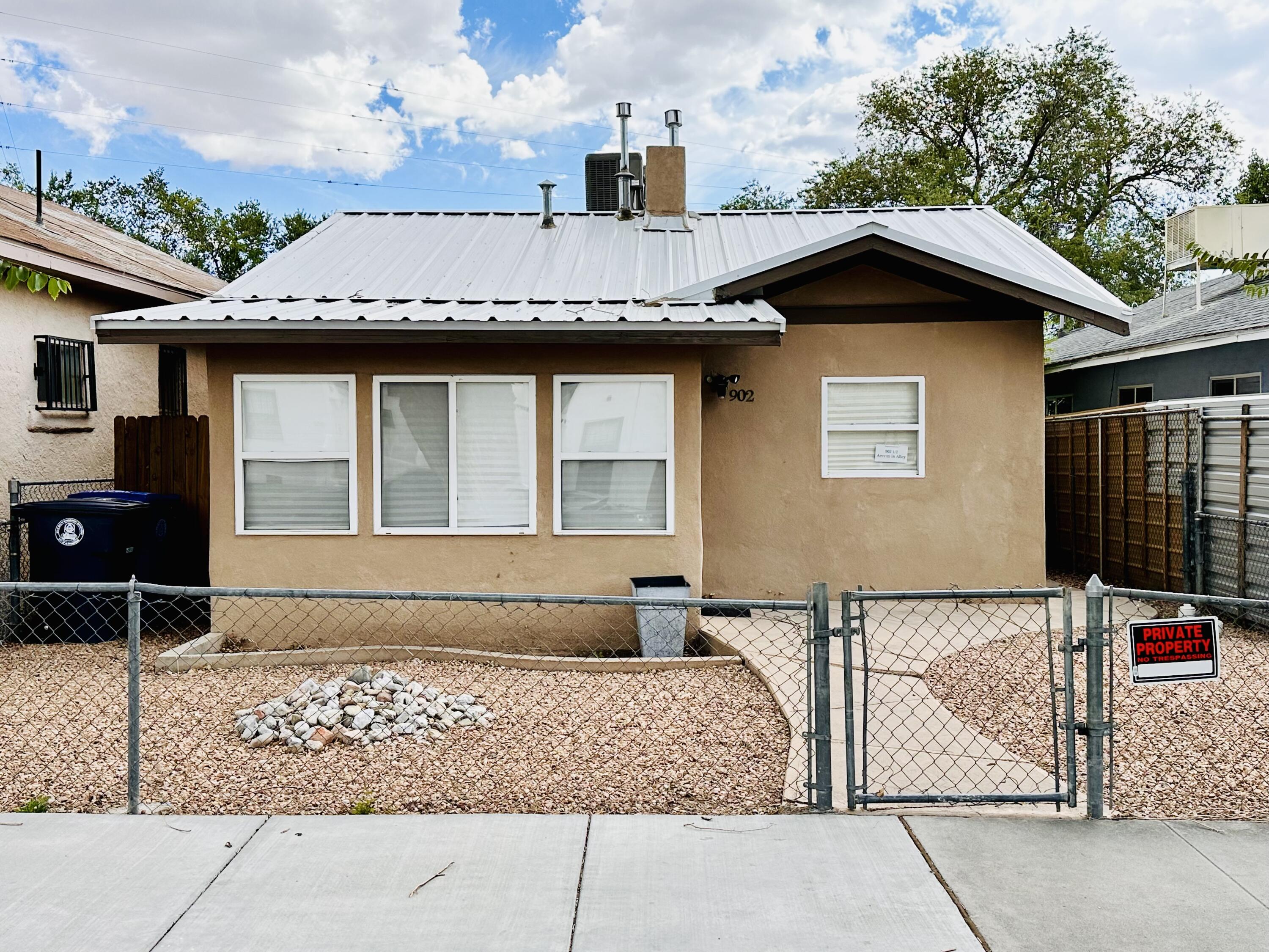 Fully Remodeled 3-Bedroom Home AND a detached 1-Bedroom Casita - Perfect for Short or Long-Term Furnished Rental. Charm meets modern convenience, located just minutes from downtown ABQ and Old Town. This property is a historical gem, remodeled with a modern clean feel. Great income potential with the Casita having its own entrance and parking through alley access. Option to purchase fully furnished with fully equipped kitchens in both units. This 2 unit property is ready for immediate move-in or to become a lucrative rental property. **Owner Broker**