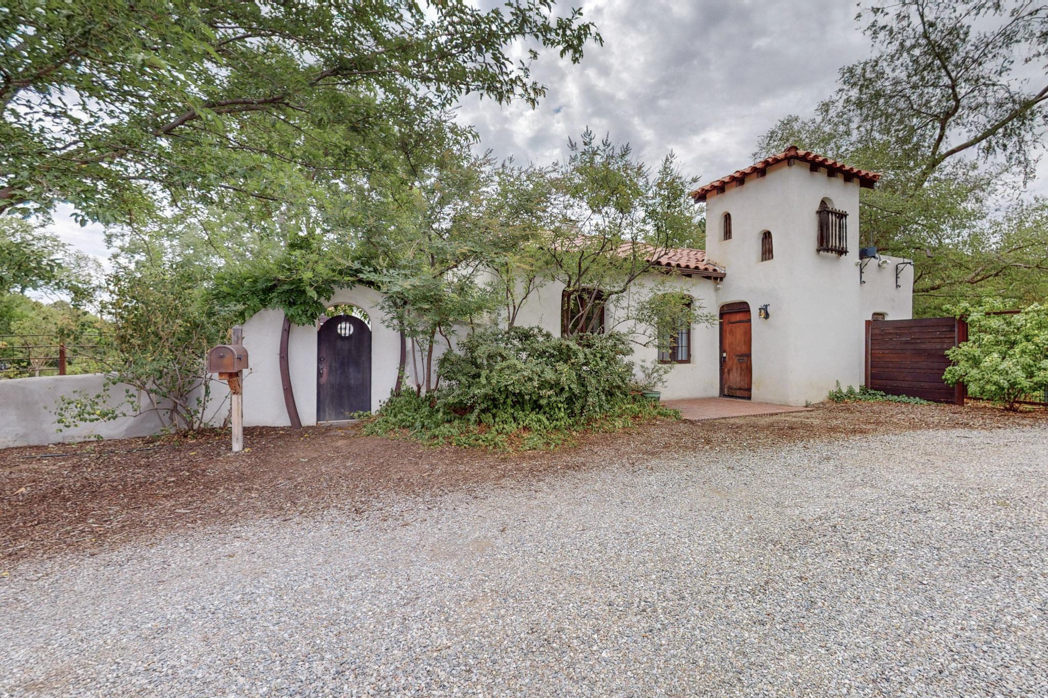 This is your chance to own a unique piece of Albuquerque history with this 1927 Katherine Van Dussen-designed home on a rare .75-acre lot in the heart of Ridgecrest. This property is one of a kind and boasts mature trees, a charming sunken rose garden that doubles as a turtle garden with over 15 turtles, a koi fish pond, and access to a community garden with a chicken coop and raised beds. The fully fenced in yard is perfect for entertaining while maintaing intimate privacy. Inside, experience the original exposed beams, and wood floors. Modern updates like upgraded electrical, a 2018 HVAC, and some parts of the roof have been replaced. The home also features a spacious laundry room and a large master walk-in closet. A perfect blend of historic charm and modern comfort awaits you