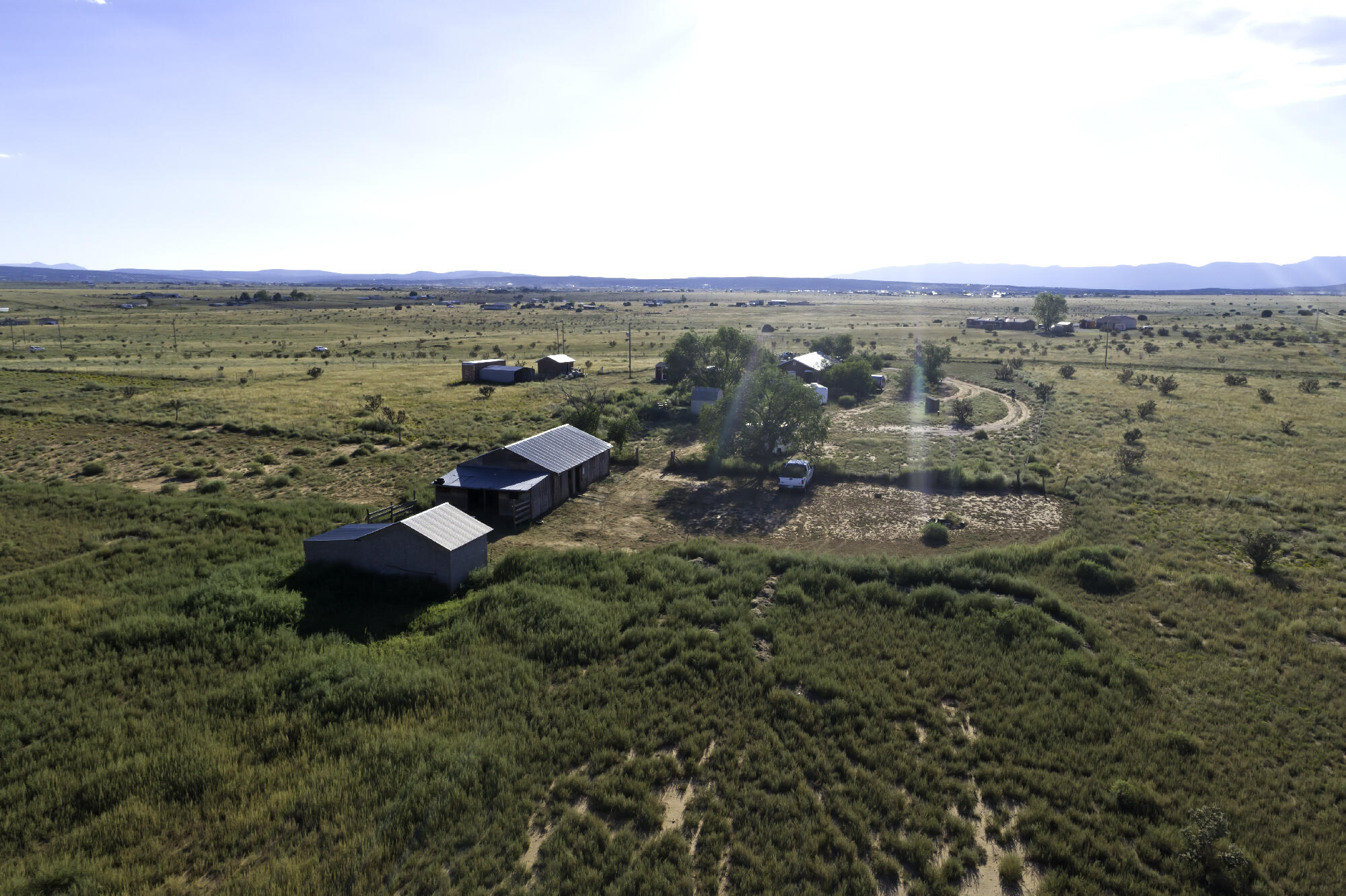 Unmatched 20-Acre Horse Property with Stunning Views! Discover the perfect blend of country living and modern comfort on this expansive 20-acre horse property, offering breathtaking views of the Pecos. This charming 2-bedroom, 1.5-bath home boasts a large covered porch, ideal for relaxing while taking in the serene landscape. Whether you're looking to build your dream home or enjoy the existing residence as a cozy guest house or in-law suite, this property has it all! Highlights include:Brick floors, freshly painted interior, and stainless steel appliancesNew laminate flooring in the kitchen and baths, plus vinyl in the laundry roomBrand-new heating and refrigerated cooling system (installed in 2023)50-amp RV outlet (installed in 2023)New circuit breaker box (installed in 2023)