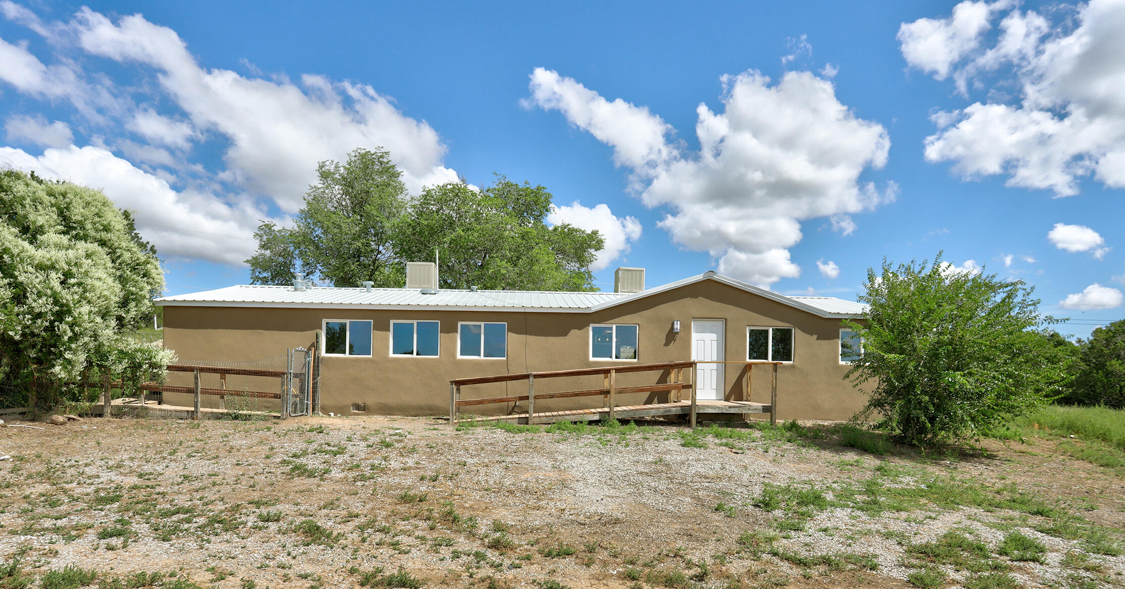 SELLER IS OFFERING BUYER CONCESSIONS with a competitive offer! Welcome to your retreat in scenic Edgewood! This gorgeous manufactured home sits on 1.25 acres, perfect for your animals and all your outdoor toys.  Inside, this bright and spacious home is filled with natural light and boasts numerous upgrades. The large living room is ideal for entertaining, while the chef's kitchen features a massive island, new stainless steel appliances, elegant cabinetry, and a stunning backsplash. Enjoy new LVP flooring, fresh paint, and updated bathrooms. The primary suite serves as a peaceful retreat with a beautiful ensuite.Outside, the expansive yard is perfect for riding, gardening, or simply enjoying nature. The property offers endless possibilities for creating your own private oasis.