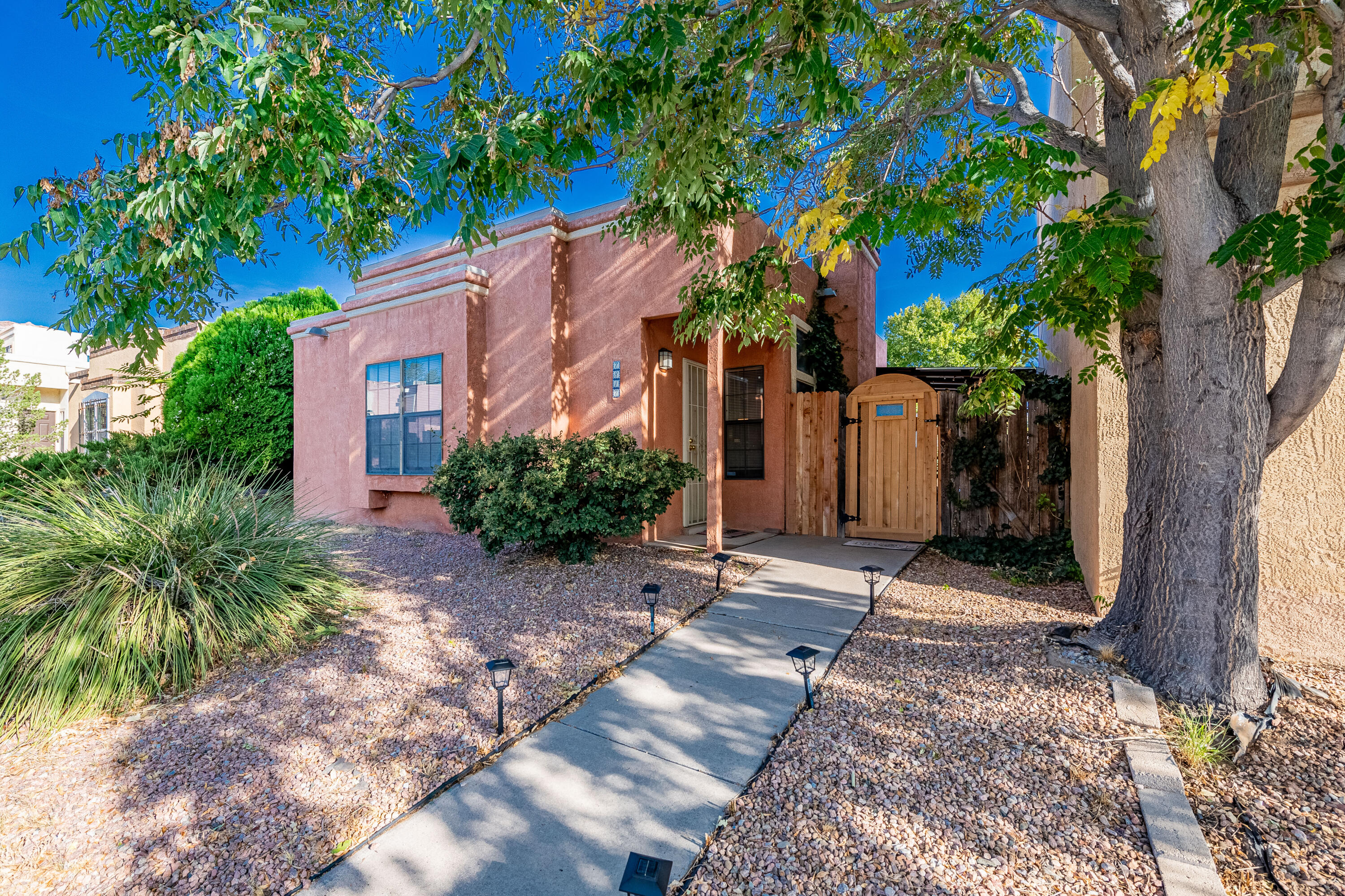 Welcome to 7817 Pinewood Drive NW, a cozy single-story home featuring 3 bedrooms and 2 bathrooms. The open layout offers a comfortable living room complete with a fireplace, perfect for relaxing evenings. The kitchen includes a breakfast nook, ideal for casual dining. The primary suite features an en-suite bath and walk-in closet for extra storage. The low-maintenance backyard provides a peaceful outdoor space to unwind. Located in a convenient neighborhood close to parks, schools, and shopping, this home is ideal for easy living in Northwest Albuquerque.Call me today for a private showing!