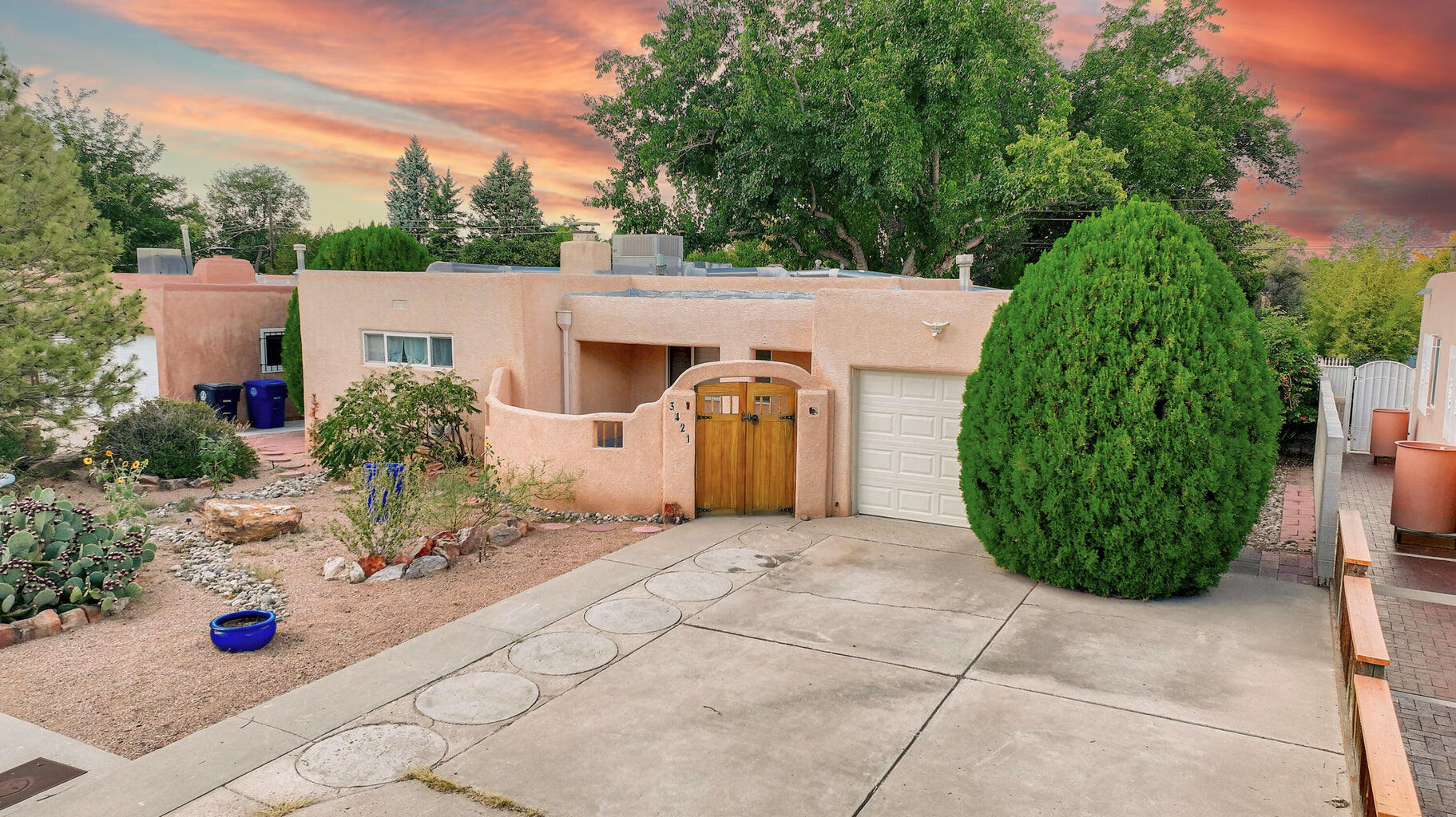 A Modern Sanctuary Near UNM.Nestled in a prime location just steps away from the University of New Mexico and the vibrant downtown, this sw style residence offers a harmonious blend of modern aesthetics and functional design.A welcoming courtyard entrance sets the tone for a serene retreat. Inside, gleaming hardwood floors guide you through the spacious living room, where natural light streams through large windows & skylights. The gourmet kitchen, featuring soaring ceiling-height cabinetry and sleek countertops, is a culinary enthusiast's dream.The thoughtfully designed floor plan includes two generously sized living areas, providing ample space for entertaining guests or simply relaxing.