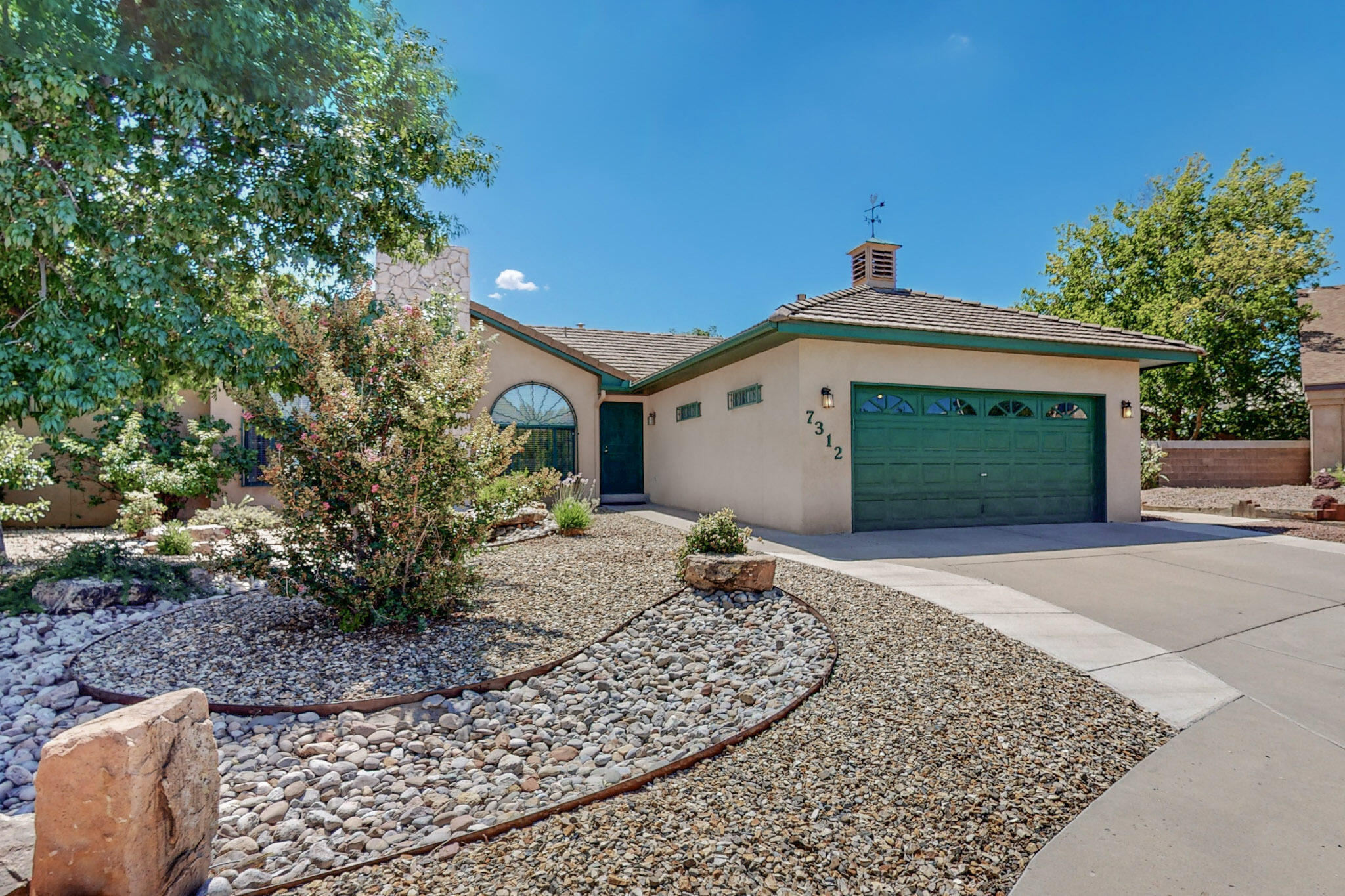 A back yard private oasis awaits you at this lovely, updated and well maintained home on a large cul-de-sac lot in the Laurelwood subdivision on Albuquerque's west side. Refrigerated air, solar panels, a gas cooktop, convection oven, quartz countertops, and updated windows and flooring are some of the upgrades. Other features include a vaulted LR ceiling, gas fireplace, a walk-in closet and separate shower and tub in the primary suite, natural wood stained 6-panel doors, a concrete tile roof, and security wrought iron windows and doors throughout. Outdoors you will find a rock fountain, a large shaded back porch, mature fruit trees, an irrigated garden, and a Tuff Shed. Easy access to I-40 helps make commuting convenient. Don't let this one get away!