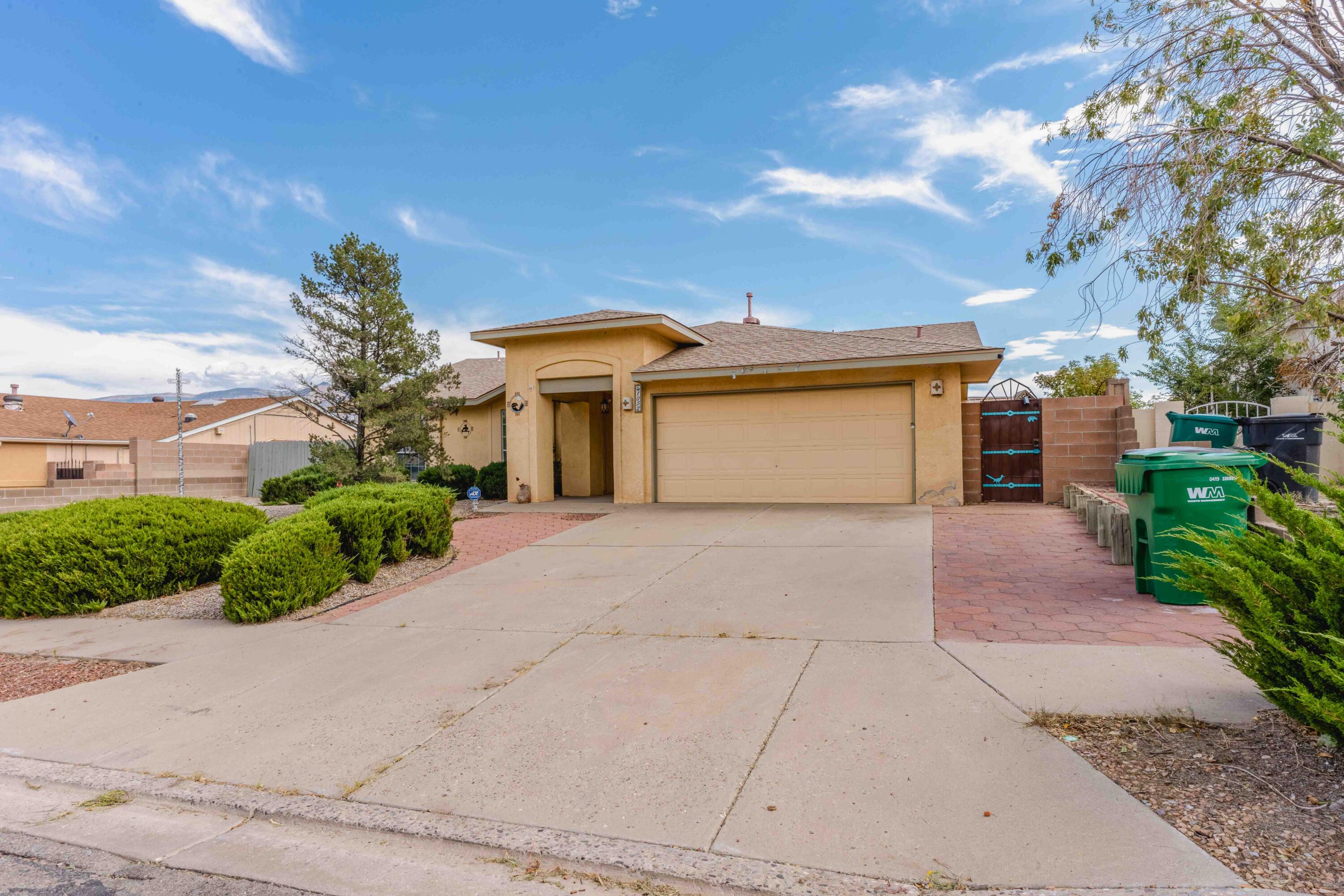 Step into this stunning home, perfectly positioned to capture panoramic views of the Sandia Mountains. The interior boasts beautiful hardwood floors in the main living area, complemented by tile and laminate flooring throughout--no carpet anywhere! The private primary suite features vaulted ceilings, a spacious ambiance, and a luxurious en suite with a double vanity and upgraded showers in both bathrooms.Enjoy cooking in the cozy kitchen with an adjacent breakfast nook, while the formal dining area off the main living space makes entertaining a breeze. The elevated backyard offers unparalleled mountain views, featuring low-maintenance artificial turf, xeriscaping, and a private gazebo with a Jacuzzi--ideal for relaxation.