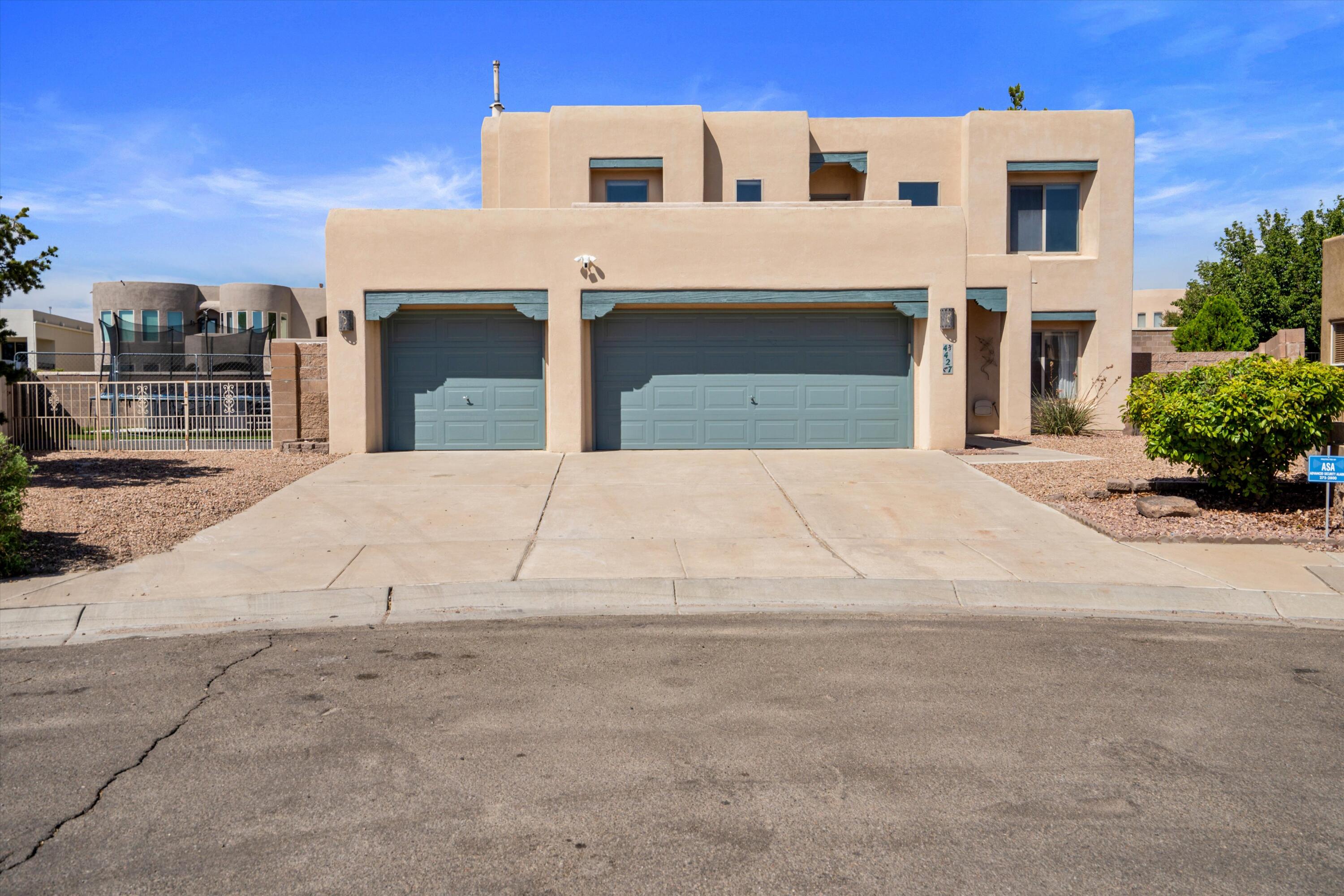 Welcome to this beautiful Pueblo style home situated in a well established and tranquil Cul-de-sac.  This  located in Sky Crest Estates. This property boasts a 3-car garage, backyard access, an inviting outdoor deck for those summer barbecues, recently installed green turf and an amazing SWIM SPA!!!  YES, the Swim Spa conveys with the property! Did we mention the VIews?!  Enjoy the Beautiful view of the Sandia Mountains from the balcony or enjoy the lush neighborhood park that is a very short walking distance away.   The neighborhood is comprised of custom built homes and its only minutes from Cottonwood Mall, Restaurants and much, much more.