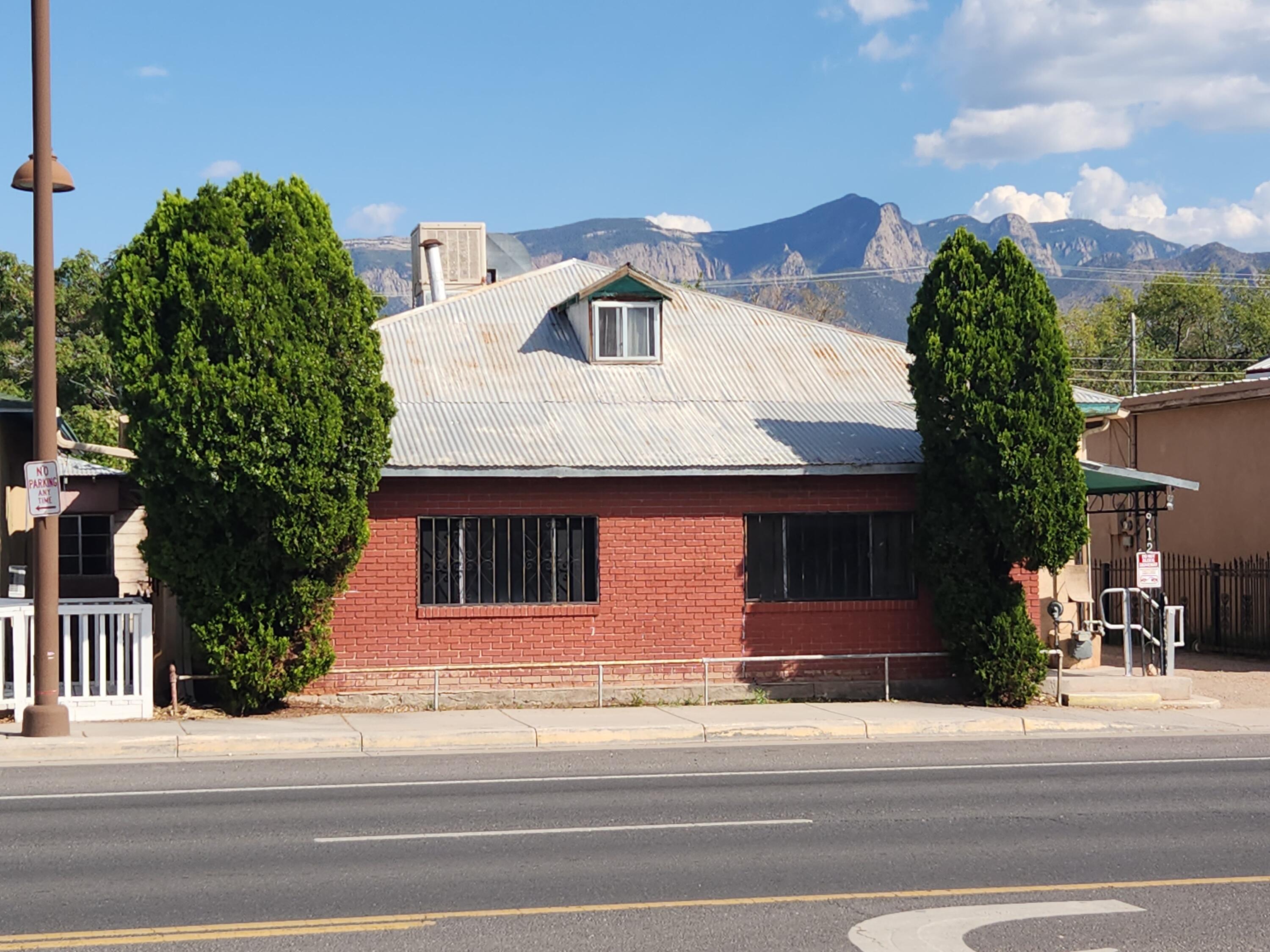 RESIDENTIAL OR COMMERCIAL! $300,000. Great location! Adobe 3 bedroom home, plus 2 bedroom detached apartment, located in the heart of Bernalillo! Lots of potential and a variety of uses! Main house is 1384 sq ft with 3 bedrooms, 1 bath, kitchen, dining room and living room. Apartment is 666 sq ft with 2 bedrooms, 1 bath and living room. Additional garage, carport & storage building. The structures all need repair and updating; they are are being sold strictly As-Is. Zoning is Commercial (C-1), which also allows Residential uses. Homes are separately metered for electricity. They can be used for residences, offices, retail, B&B, etc. Wonderful location on the main street in Bernalillo, across the street from The Range Restaurant, with quick access to I-25 and Albuquerque.