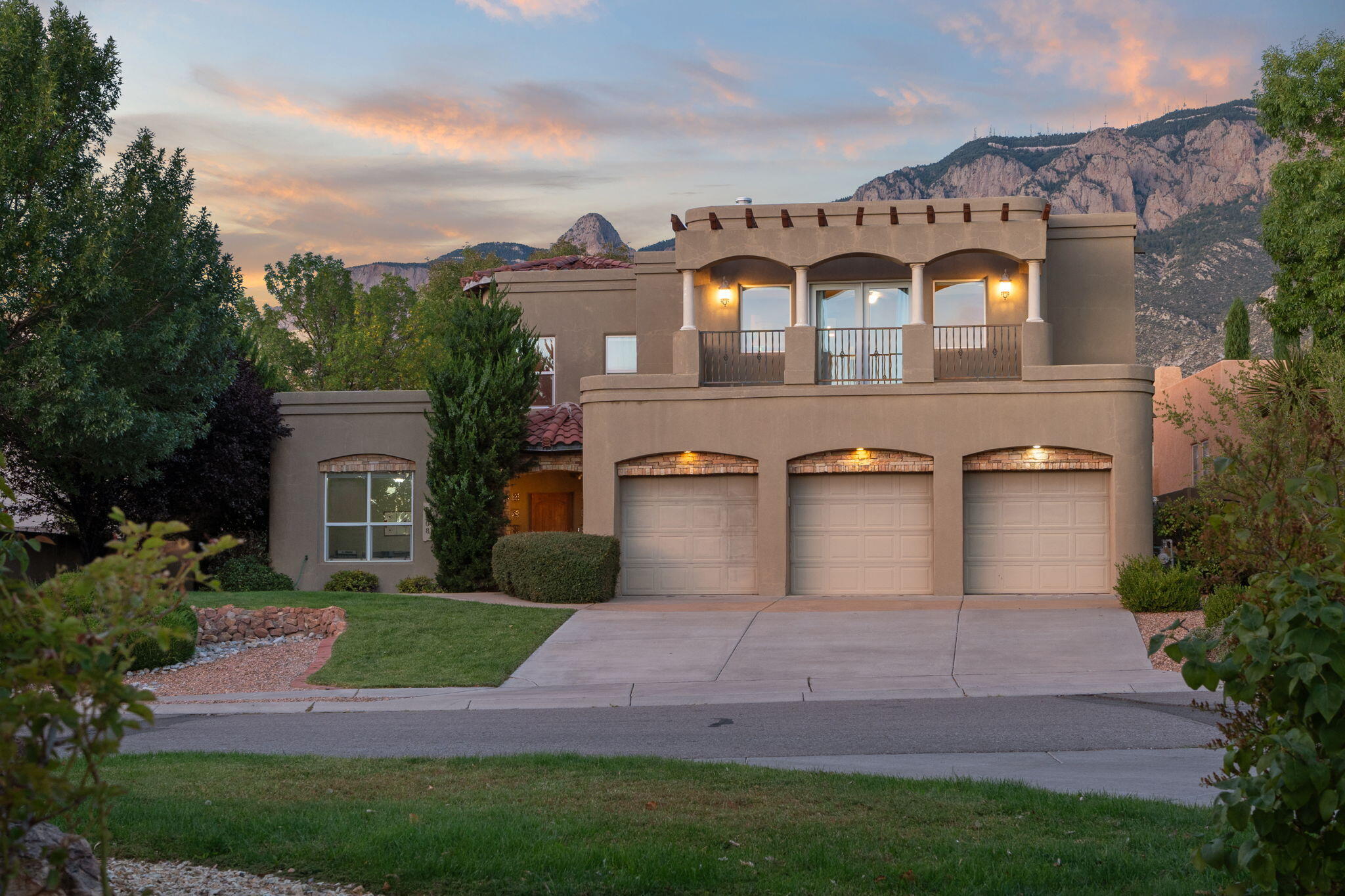 Discover unparalleled luxury in this stunning custom built home nestled in the coveted Primrose Pointe community. A sweeping staircase welcomes you in to the main level featuring a large living room with two story high ceilings, ample windows allowing majestic mountain views of the Sandia and s stacked stone gas fireplace. The primary bedroom is downstairs, with ensuite featuring a walk in closet, double vanity sink, jetted tub and separate shower. The perfectly manicured backyard also includes a serene water feature for your enjoyment.