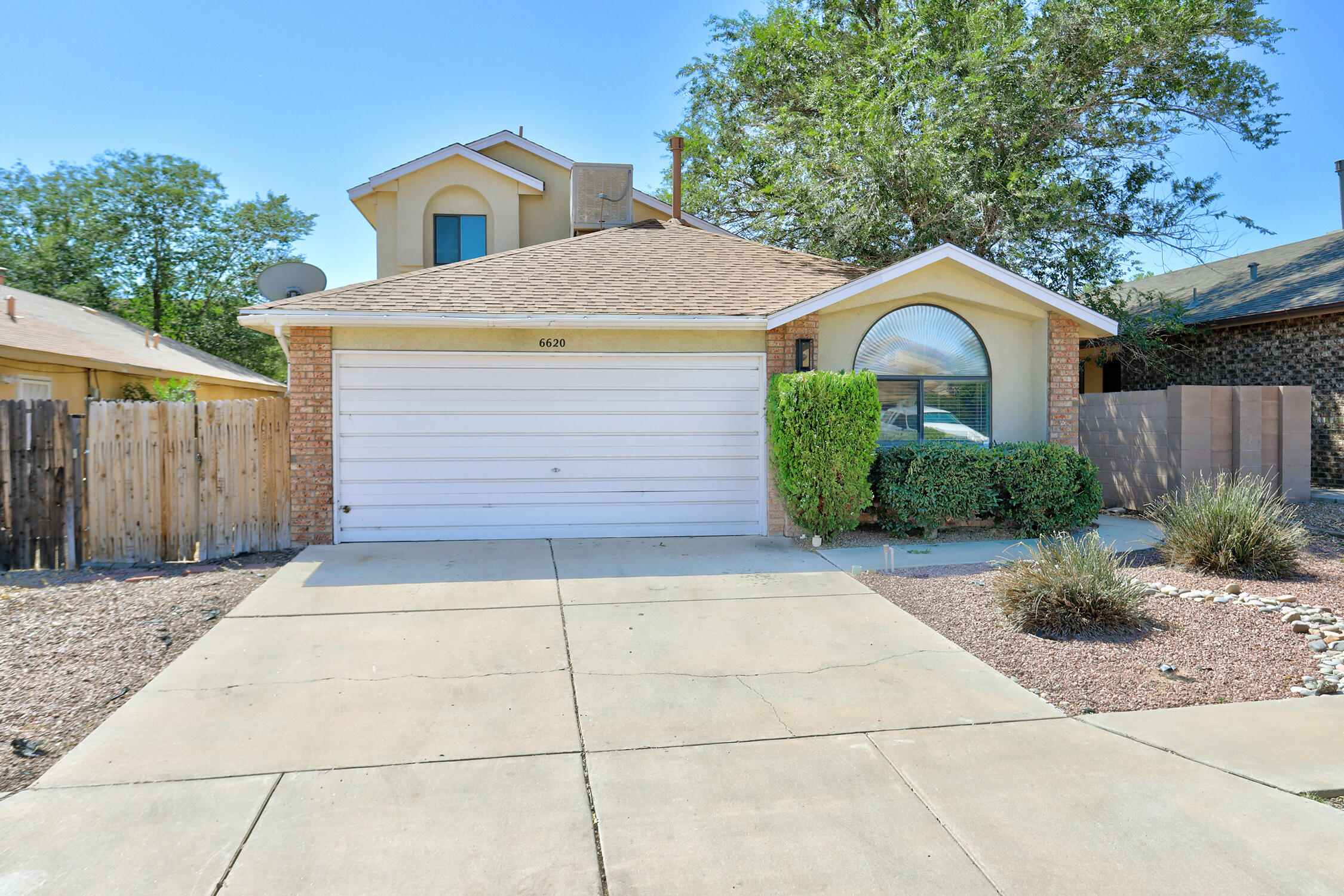 Welcome to this amazing Artistic Home with VIEWS and open floorplan! Located in the heart of Taylor Ranch. 2 blocks away from the National park with trails. You also have the large Santa Fe Village park/Public Library. As you go in you'll notice the upgraded flooring, XL modern fan, and newer paint throughout. The vaulted ceilings makes the house feel much larger then it is. Kitchen has all matching black appliances only a few years old. All new light fixtures thought-out. Upstairs takes you straight to the primary bedroom which gives great separation with the bottom bedrooms. Primary bedroom features two closets! Going to the backyard you'll immediately be greeted with a large patio that was just painted and VIEWS to the Petroglyph's! Volcano Vista school district!