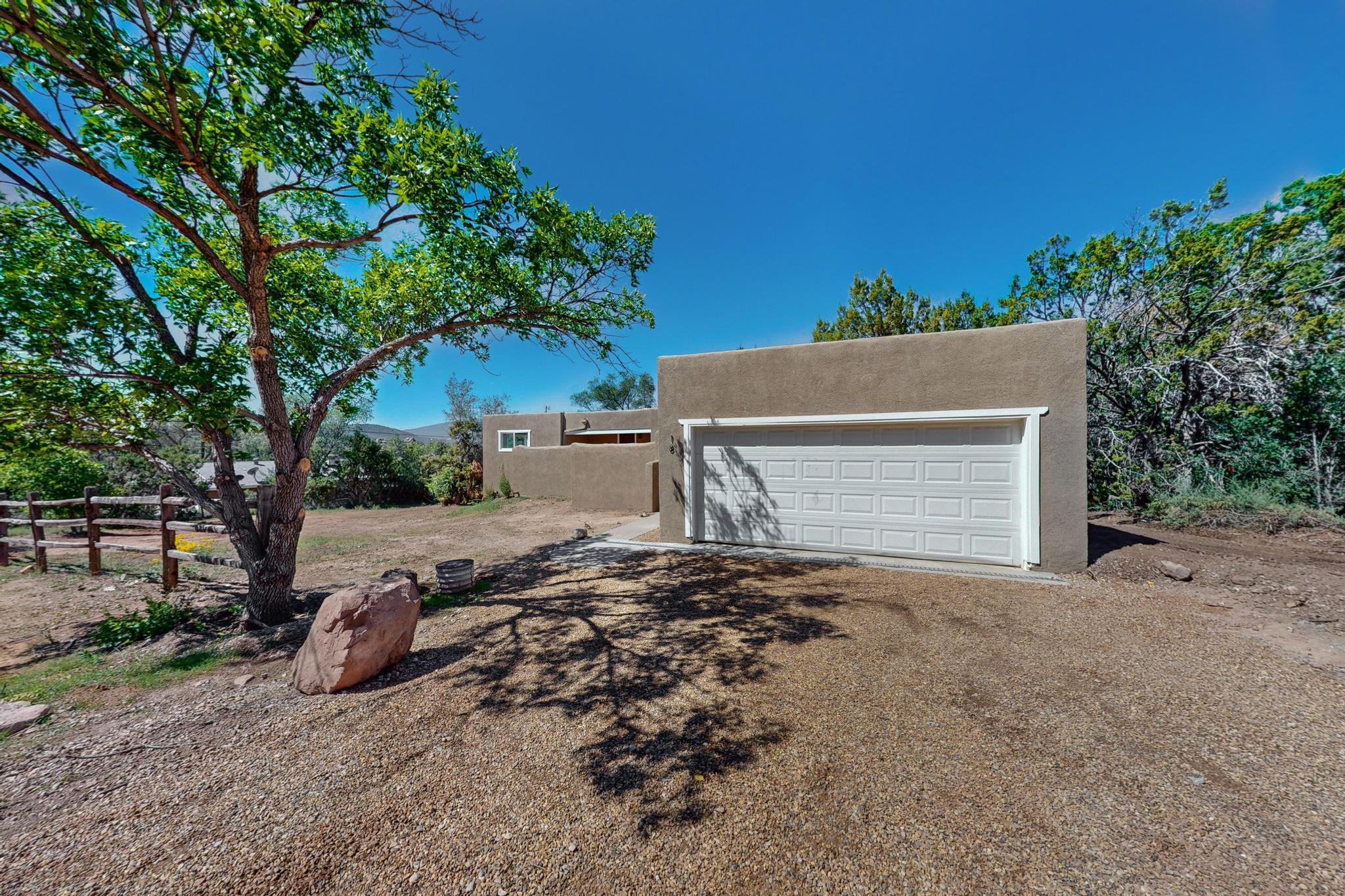 Nestled in the serene beauty of Sandia Park, this stunning 4-bedroom home offers breathtaking mountain VIEWS and peaceful surroundings. The spacious layout includes an oversized master suite, providing a perfect retreat with its luxurious en-suite bathroom and large walk-in closet. The open-concept living and dining areas are filled with natural light, creating a warm and inviting atmosphere for entertaining or relaxing. The modern kitchen features ample counter space and cabinetry, perfect for any home chef. Outside, enjoy the stunning views from the expansive deck, ideal for soaking in the tranquility of the surrounding nature. With plenty of room for everyone, this home offers both comfort and elegance in a spectacular setting.