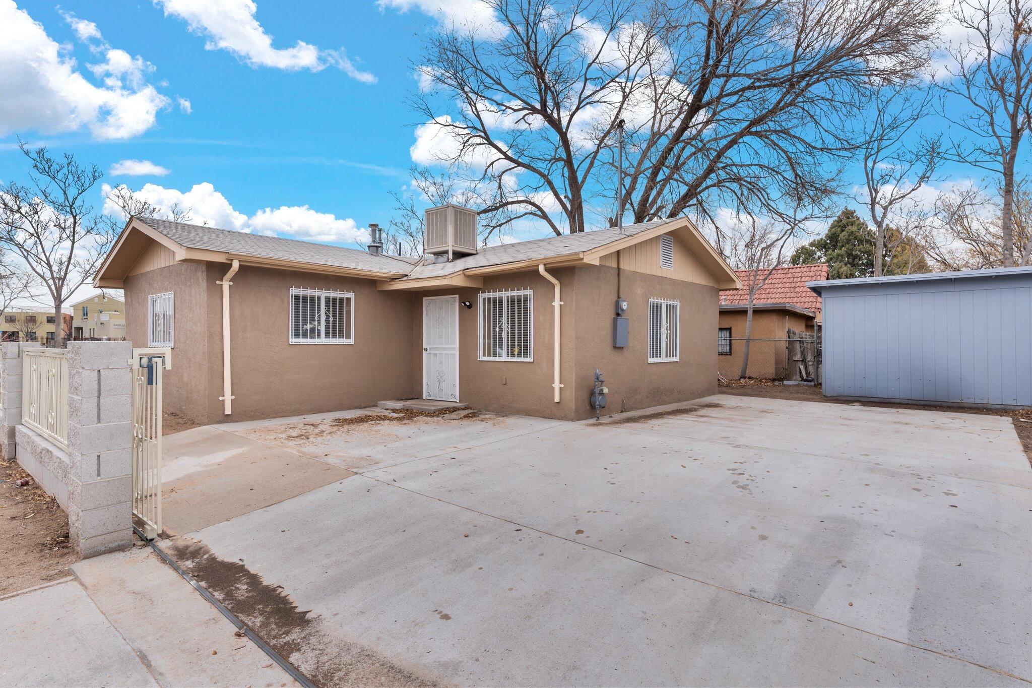 Newly Renovated Makeover! Updated! Located in the heart of the historic Barelas Neighborhood. RECENT UPGRADES include: shaker cabinets, coutertops, light fixtures, carpet, sim. wood flooring, shaker vanity and countertop, tub eclosure, toilet, fresh paint, window coverings and H20 heater! Country Kitchen. Generously sized bedrms. Large laundry room. Fenced. Shed stays. Conveniently located with easy access to I-25, downtown, the bio parkzoo, UNM, CNM, Railyards Market, shopping , dining, entertainment, Tingley Beach, Hispanic Cultural Center, walking/riding trails, City Plaza, hospitals, Rail Runner Train and the city transit bus line. Bonus lots across from home included in the purchase.  (purchaser to pay any additional closing costs if any for additional lots.)