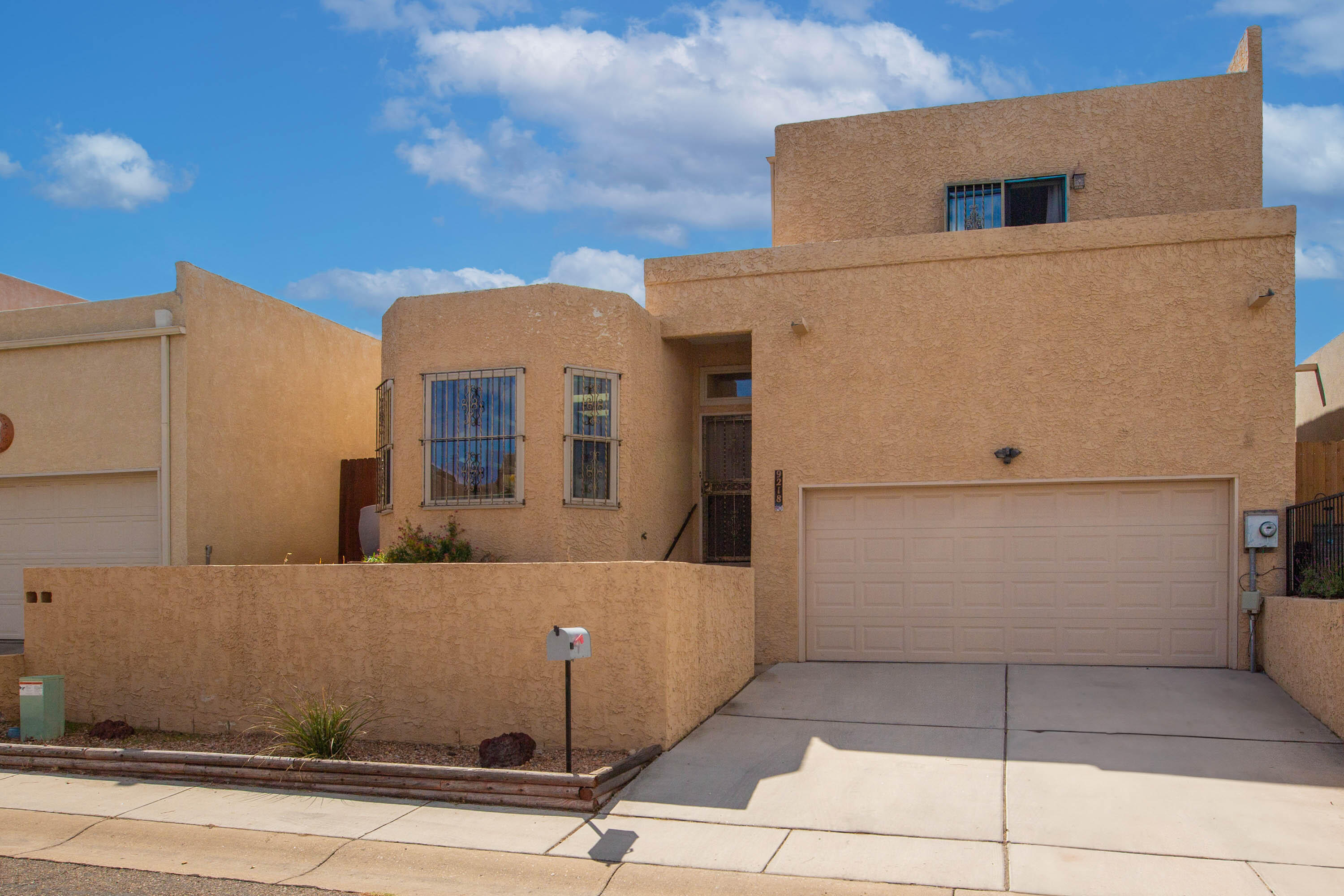 Bright and inviting 2-bedroom, 2-bathroom patio home in highly desirable NE Albuquerque. Featuring skylights, vaulted ceilings, and a cozy pellet stove. This home offers a low-maintenance yard and all appliances conveying. Over-sized garage provides extra storage space. Ideally located near shopping centers, walking trails, Osuna Golf Course, and parks--perfect for easy living!