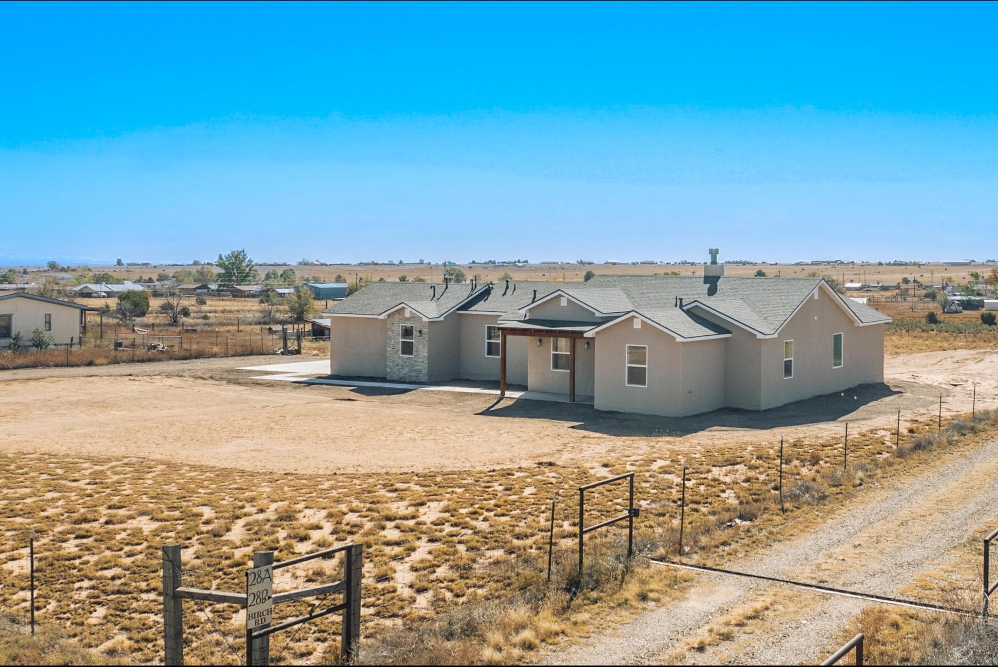 Brand new custom home on over 1 acre in Edgewood. Community Water, natural gas, fenced and gated. 3 roomy bedrooms plus an extra office/ study or spare room. Ceiling fans, black stainless appliances, and rock face wood burning fireplace. Folding glass slider onto the covered back patio.