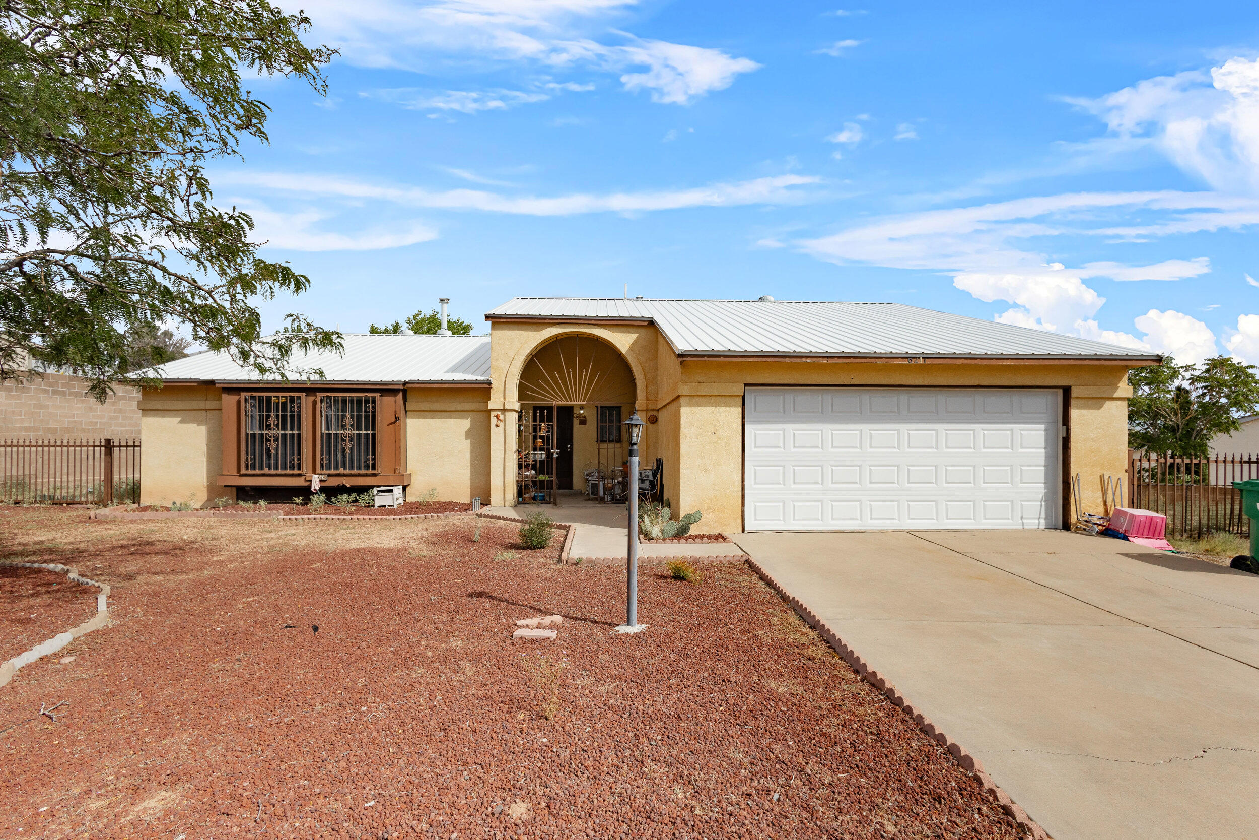 Welcome Home!  This 3 bedroom 2 bathroom cutie features vinyl flooring and a metal roof.  The backyard is large and there's RV access in the front yard, next to the driveway.   Personal items have been removed from listing