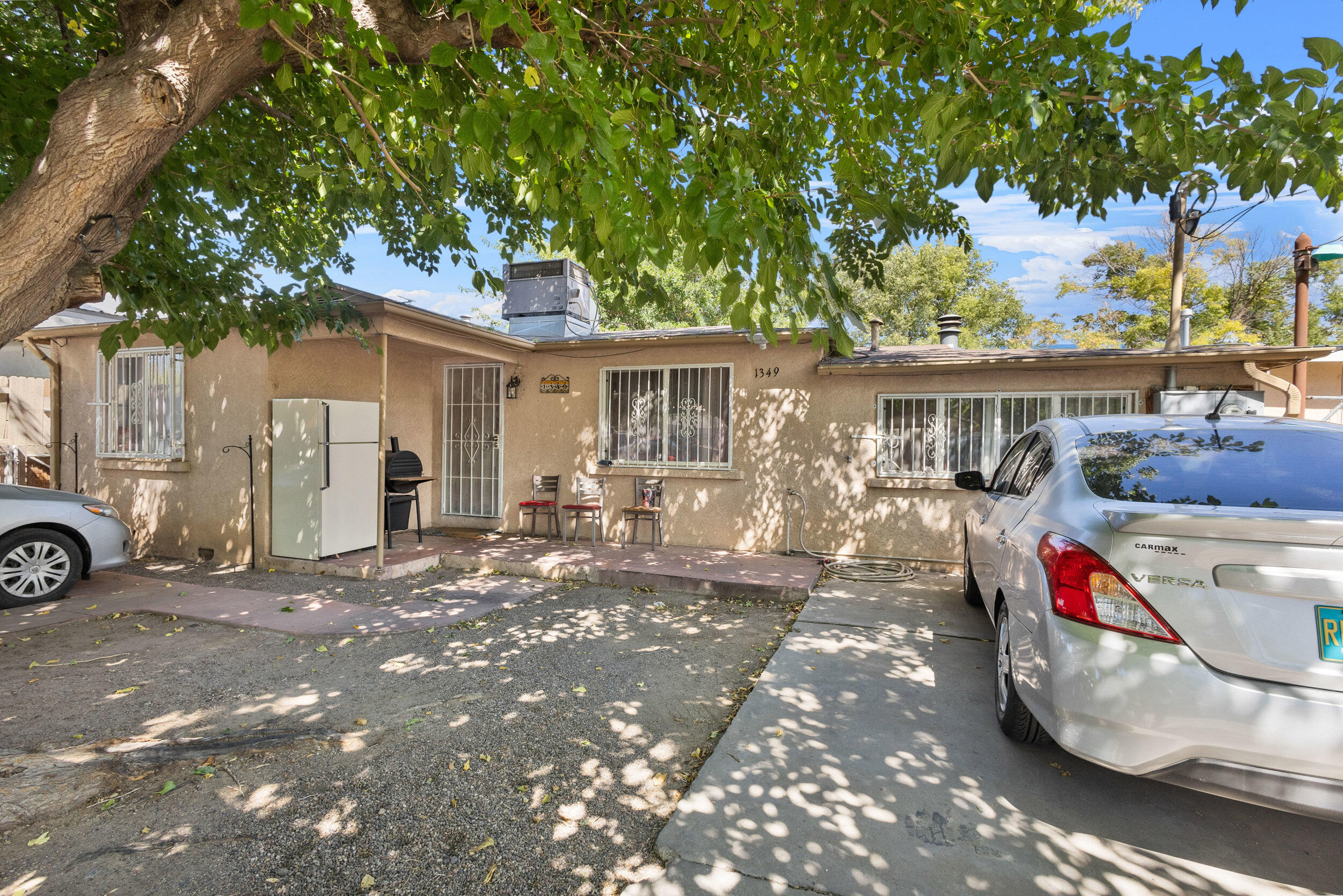 Introducing a unique opportunity for homeowners or savvy investors! Nestled in the vibrant heart of Albuquerque, this charming property offers not just one, but two homes on a single lot. The main house features three cozy bedrooms and one bathroom, perfect for family living. The delightful guest house adds two more bedrooms and a bathroom, making it an excellent choice for rental income or extended family stays. This property not only delivers on all fronts with its amenities and prime location but also adds a touch of warmth with its inviting outdoor spaces. Whether you're looking for a multi-family home or a golden investment opportunity, this setting offers both comfort and convenience. Don't miss your chance to claim this little slice of Albuquerque charm!