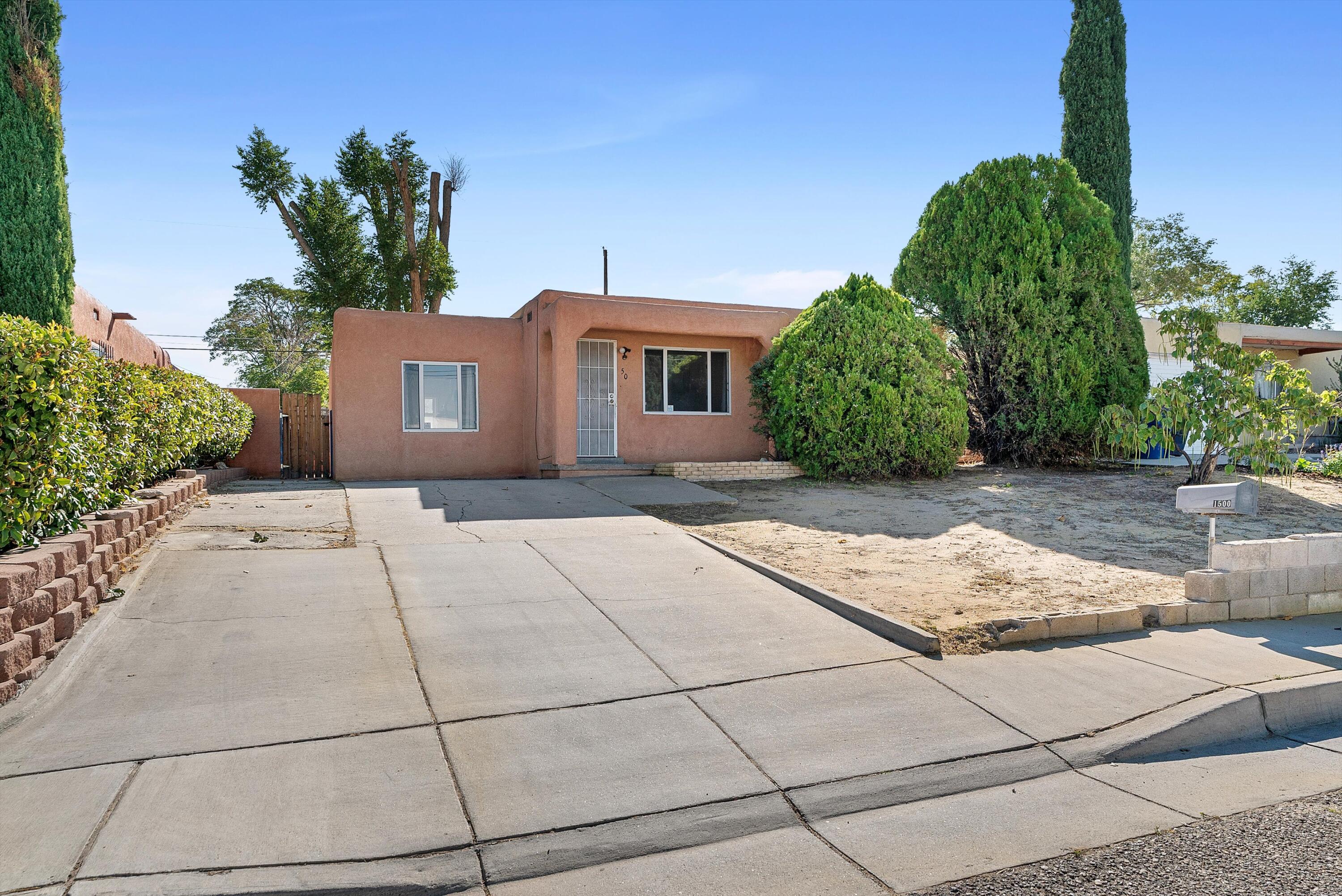 Welcome to this affordable home, not far from UNM and close to Isotopes Park as well as easy access to I-25.  This home is situated on a large lot with mature trees.  Nice size living area and the kitchen is spacious with an eat in dining space as well.  Front bedroom is a nice size and features a 3/4 bathroom.  Come see this great property today.