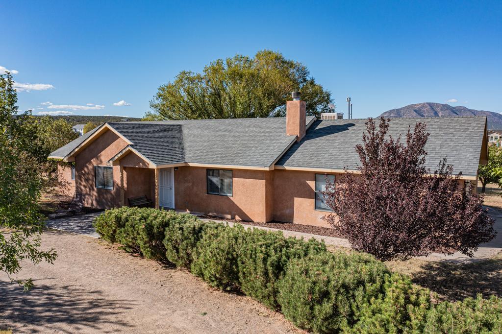 Welcome to this beautifully updated 3-bed, 2-bath home in Edgewood, NM, offering modern living with added conveniences. Inside, enjoy brand-new cabinets, countertops, sinks, faucets, lighting, fans, blinds, vanities, and mirrors. A new water heater and roof ensure peace of mind. The outdoor space features a 24x45 RV pad, with power, water, internet, and sewer hookups, plus a potential casita or workshop with utilities and internet ready at the box. The fully enclosed garden and chicken coop, both with water access, are perfect for hobbyists. Kids will love the playground, and additional storage sheds and fruit trees add value. Don't miss this unique opportunity!